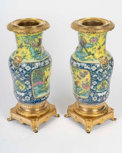 Pair of Gilt Bronze and Chinese Porcelain Vases, 19th Century.