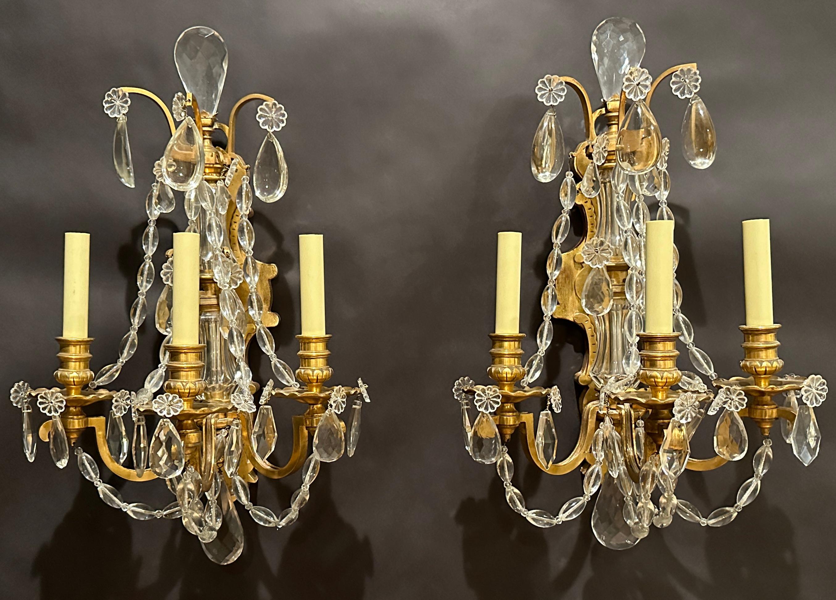 Gilt bronze and crystal Versilles style Circa 1900 Louis XVI wall appliqués. Fine quality with unusual crystal pain oval crystal chain garland elegantly draped over gilt bronze flat square arms.