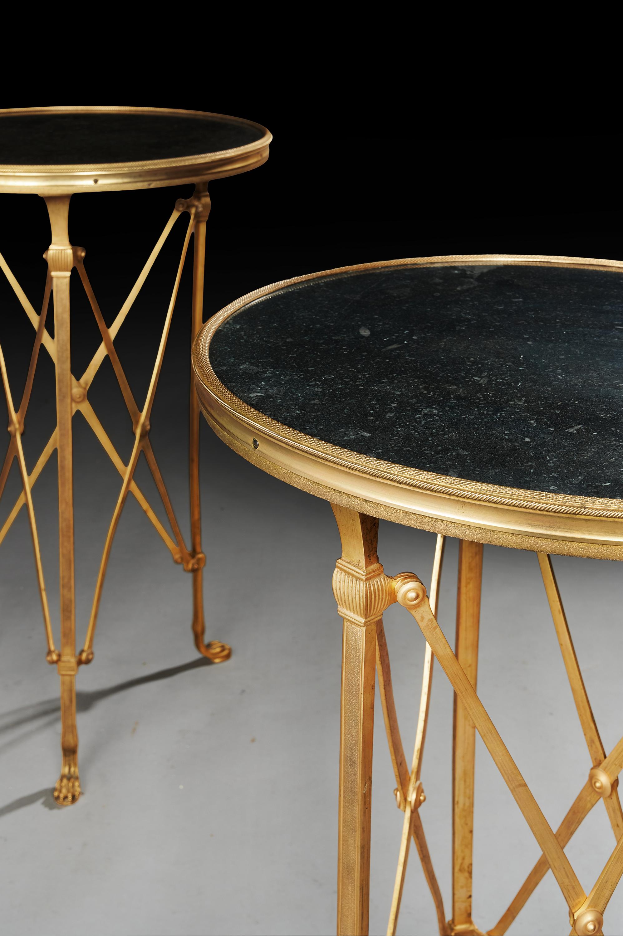 Very fine pair of French gilt bronze and Belgium black fossil marble gueridon tables in the neoclassical taste.

French circa 1900-1920.

Finely cast pair of French gilt bronze guerdon - side tables having a inset black Belgium fossilised marble