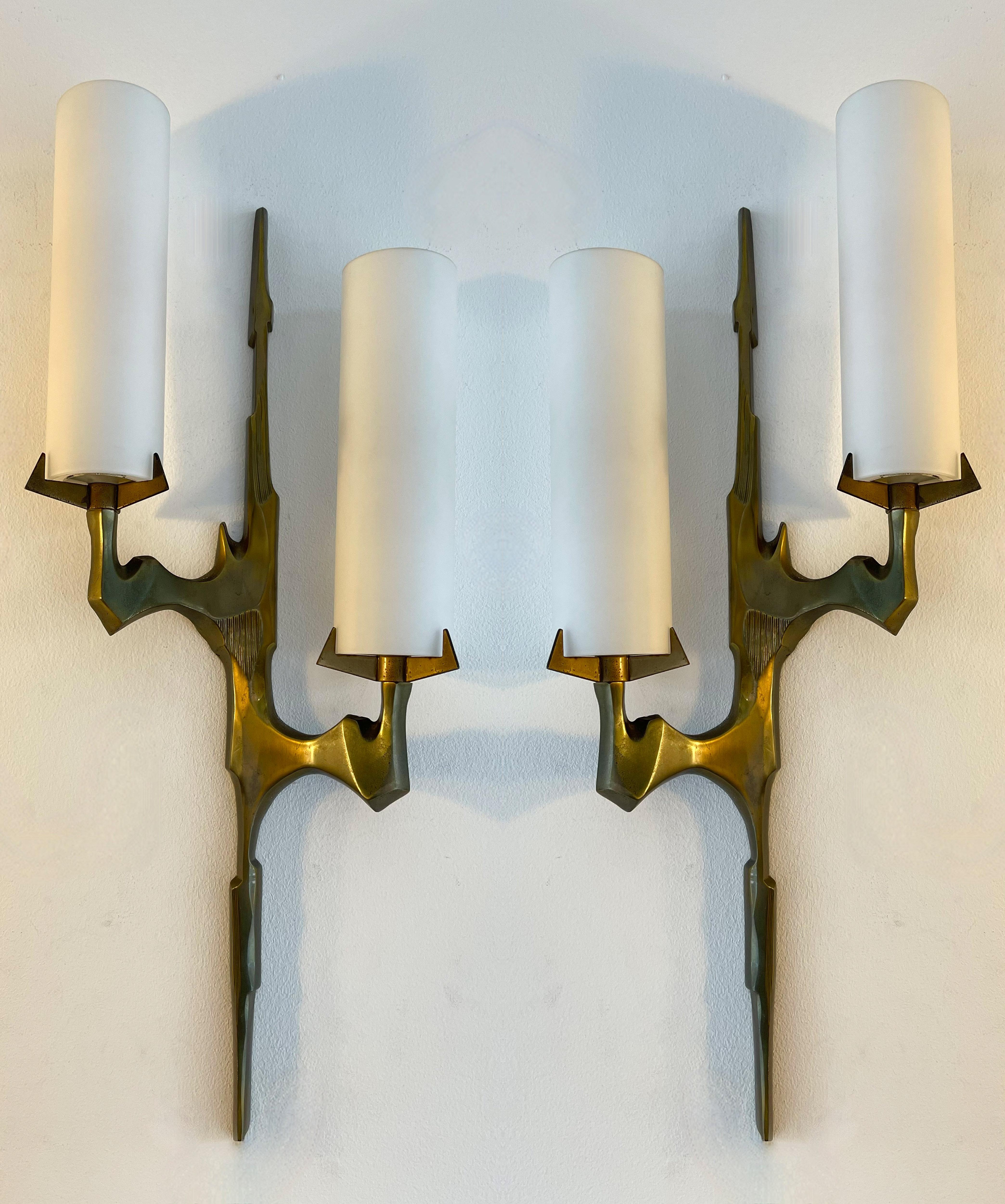Mid-Century Modern pair of or set of 2 sconces wall lights lightning lamps by Maison Arlus. In cast gilt bronze and opaline glass. Rare model, nice patina. Original documentation on request. famous manufacture like Stilnovo, Arteluce, Arredoluce,