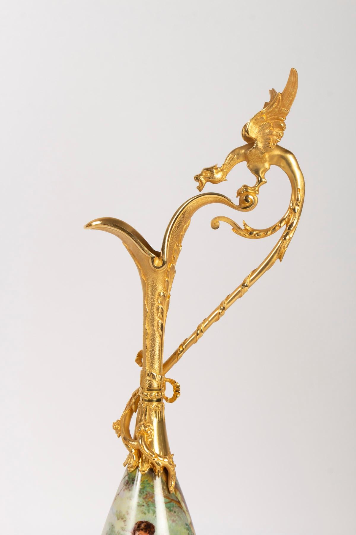 Pair of gilt bronze and porcelain ewers with a Winged Dragon, Napoleon III, hand painted scenes on porcelain in the taste of antiquity, 1880
Measures: H 64 cm, W 23 cm, D 15 cm.