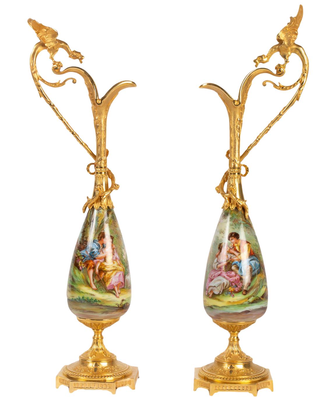 Pair of Gilt Bronze and Porcelain Ewers Topped with a Winged Dragon