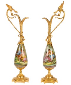 Pair of Gilt Bronze and Porcelain Ewers Topped with a Winged Dragon