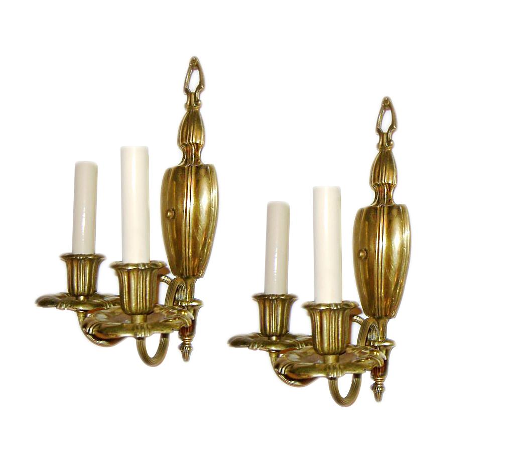 Pair of American circa 1920's gilt bronze two-arm neoclassic style sconces by Caldwell.

Measurements:
Height: 13