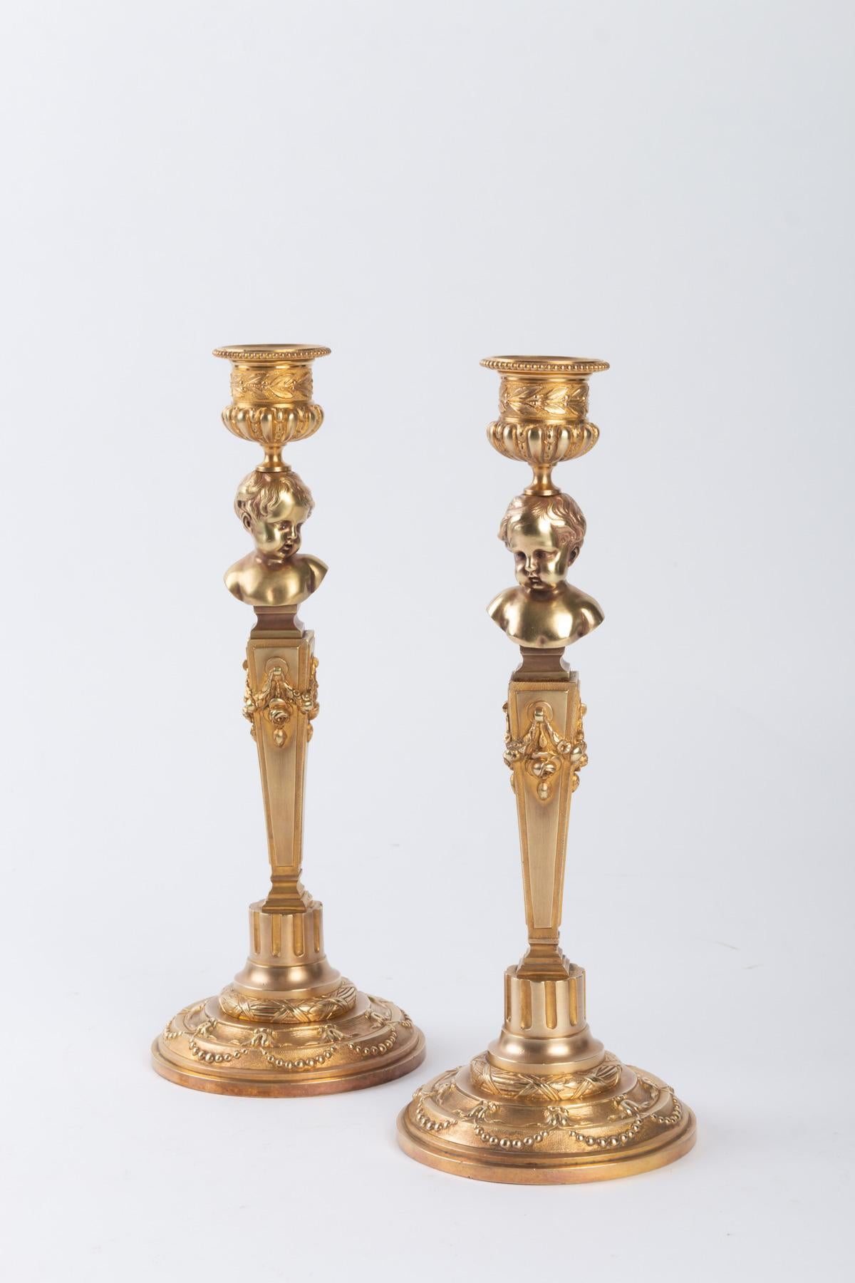 Pair of gilt bronze candelabras. French work, circa 1900.
Measures: H 25.5 cm, D 10 cm.