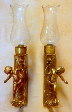 Pair of Gilt Bronze Cherub Sconces with Hurricane Shades