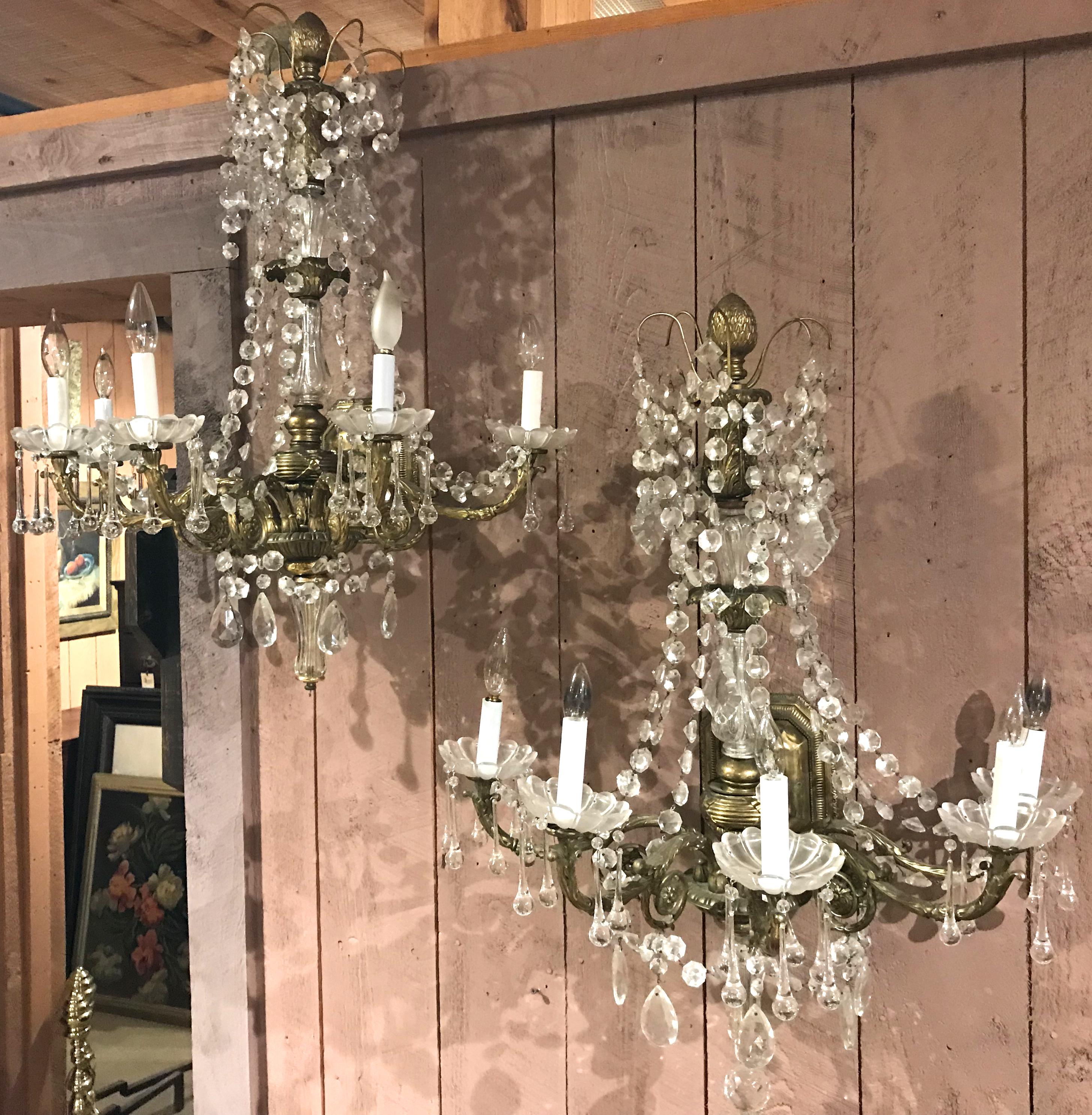 A spectacular pair of vintage gilt bronze five-light sconces with Baccarat style diamond cut crystals, possibly from the Cristallerie de Paris, circa 1930s. Additional elongated teardrop prisms have been added to this attractive pair. Very good