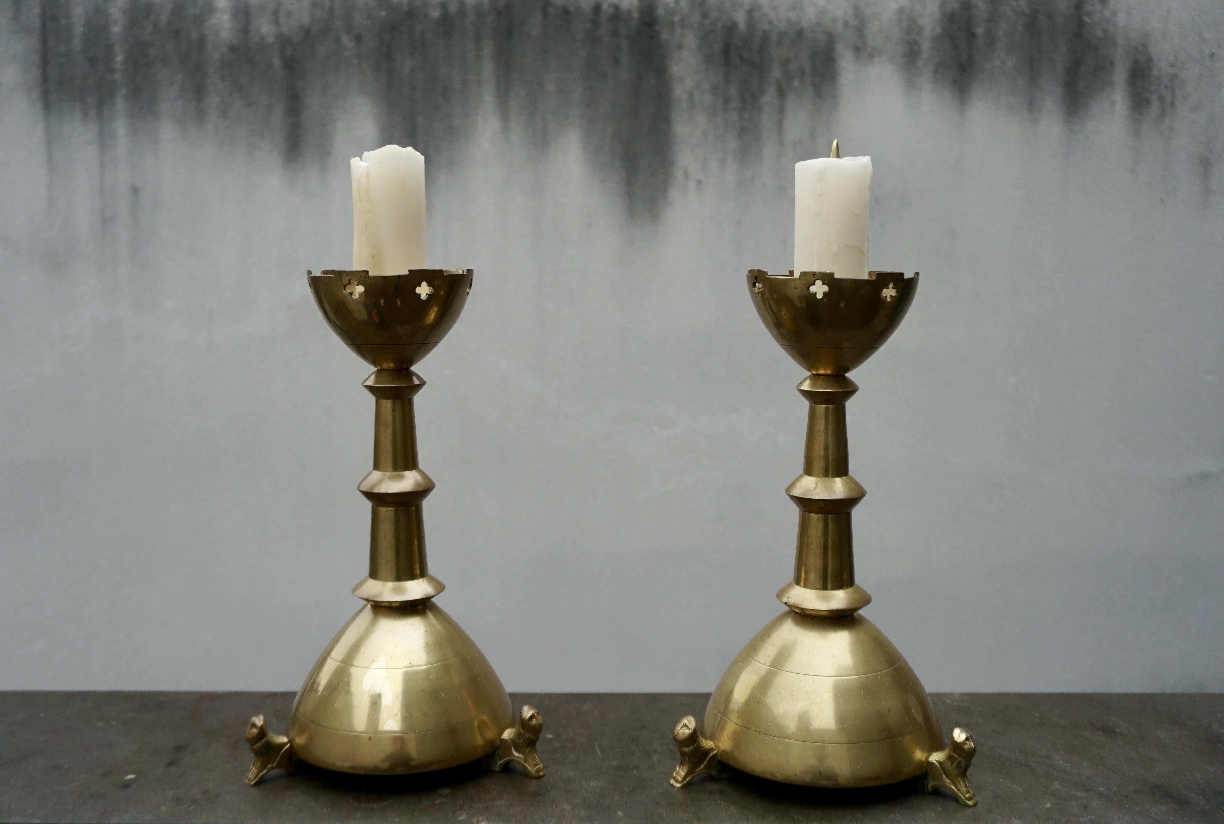 Rare and stunning pair of Flemish, Medieval Style candlesticks with crouching lions.  

If you are looking for the best quality and best condition antiques only then this rare pair could be perfect for your home or house of prayer. Because of their