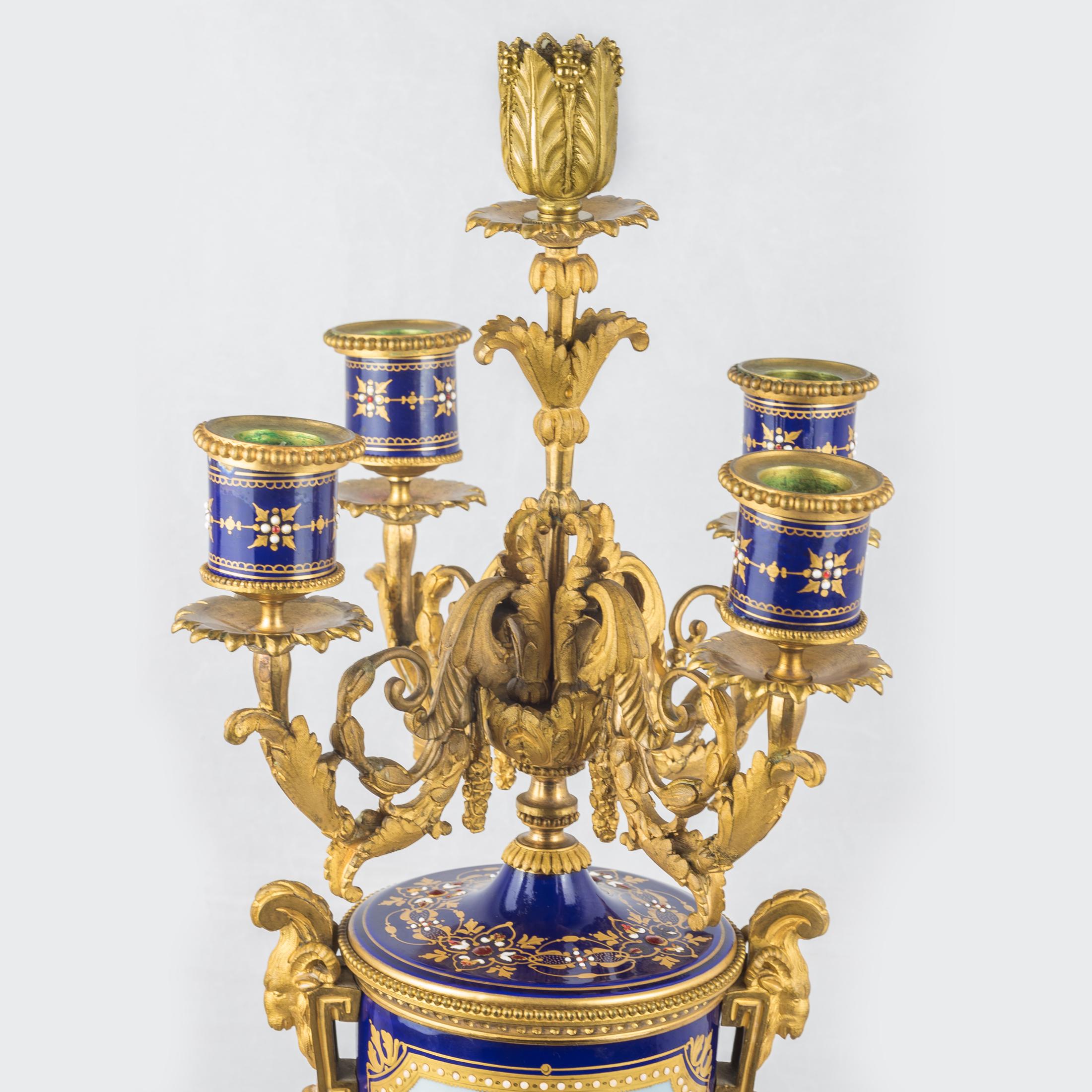 An exquisite pair of four-branch gilt bronze and jeweled cobalt blue ground Sèvres style Porcelain candelabras.

Date: 19th century
Origin: French
Dimension: 24 1/2 in x 9 1/2 in.
     