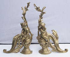 Paire de chenets de style Louis XV en bronze doré