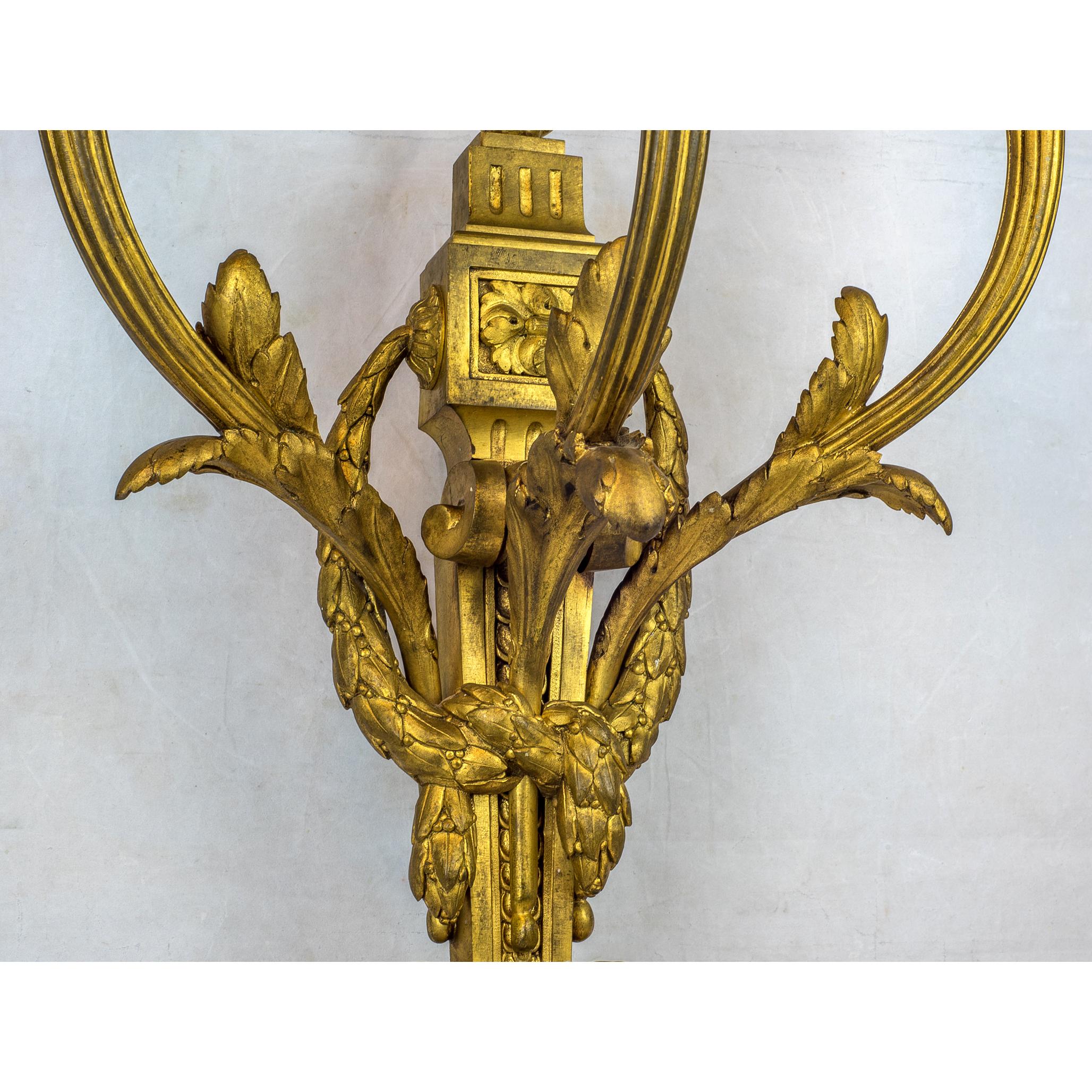Pair of Gilt Bronze Louis XVI Style Three-Light Wall Light Sconces In Excellent Condition In New York, NY