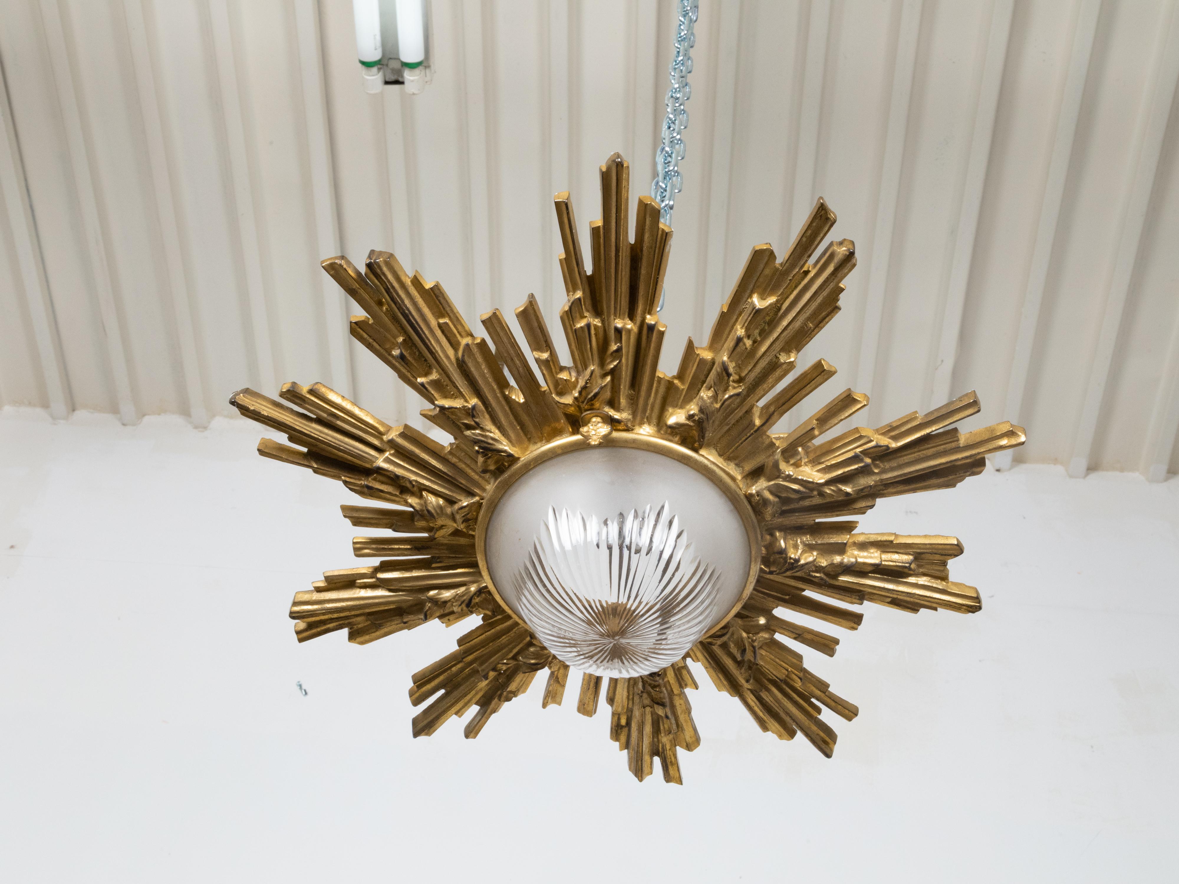 20th Century Pair of Gilt Bronze Midcentury Sunburst Light Fixtures with Frosted Glass For Sale