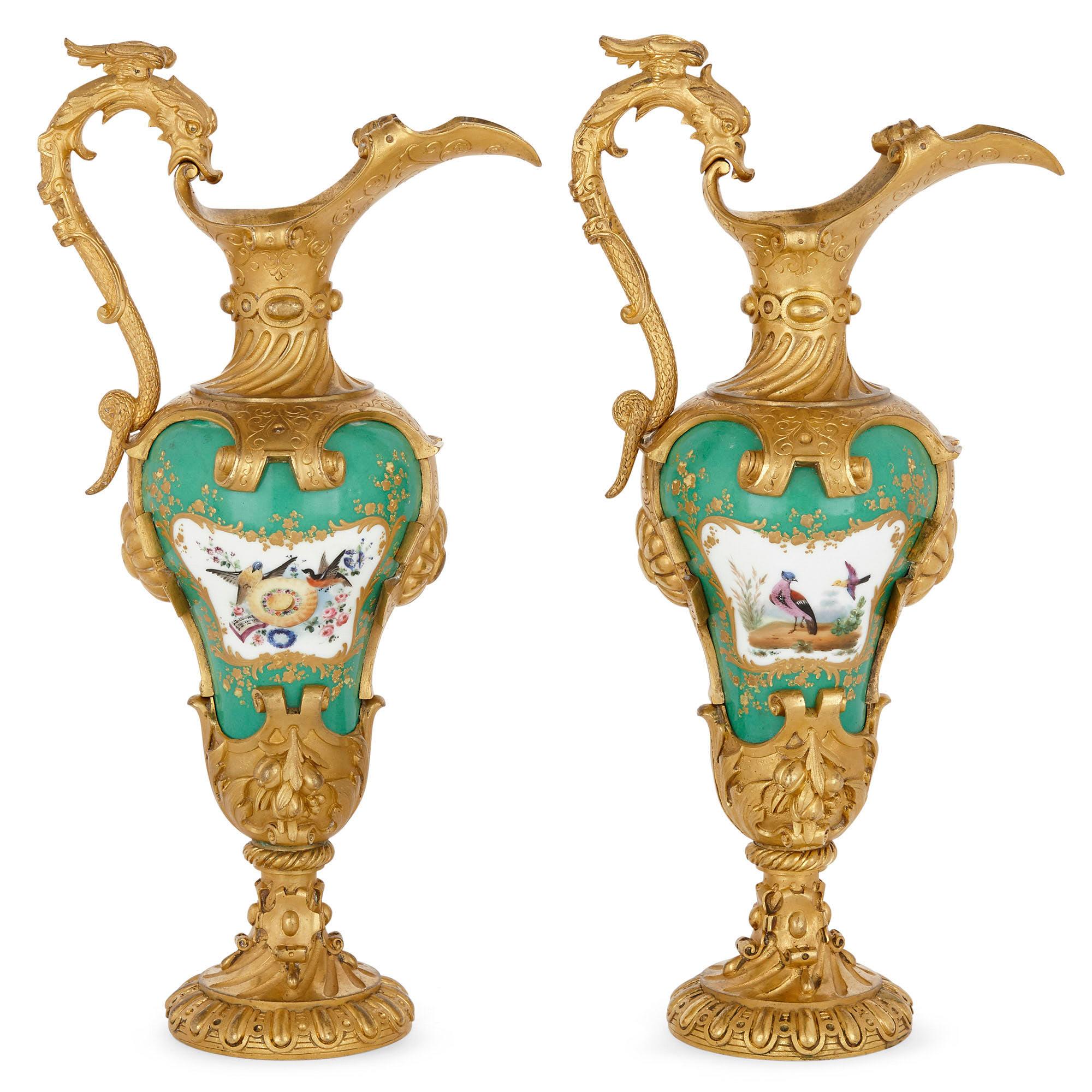 This Sèvres style porcelain vases in this pair are mounted with gilt bronze. The overall design scheme is exceptionally ornate, the bronze casting and the painted porcelain betraying the Louis XV style. Most unusually, each vase is shaped like an