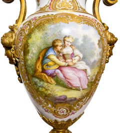 Pair of Gilt Bronze Mounted Sèvres Style Porcelain Urns