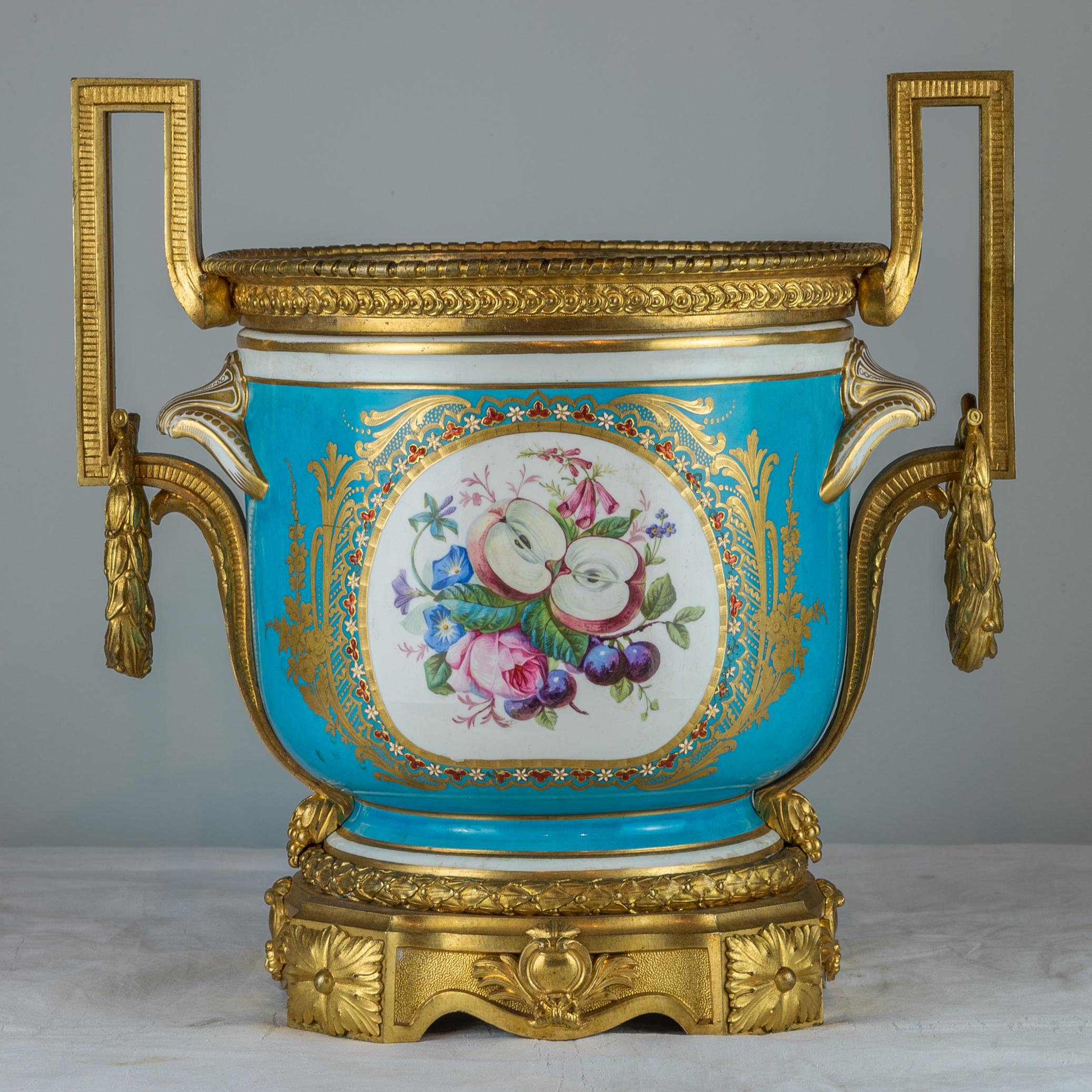 A pair of exquisite gilt bronze mounted turquoise ground Sèvres style jardinières. Finely hand painted lovers scene and beaded. 

Origin: French
Date: 19th century
Dimension: 13 1/4 x 13 x 9 1/2.