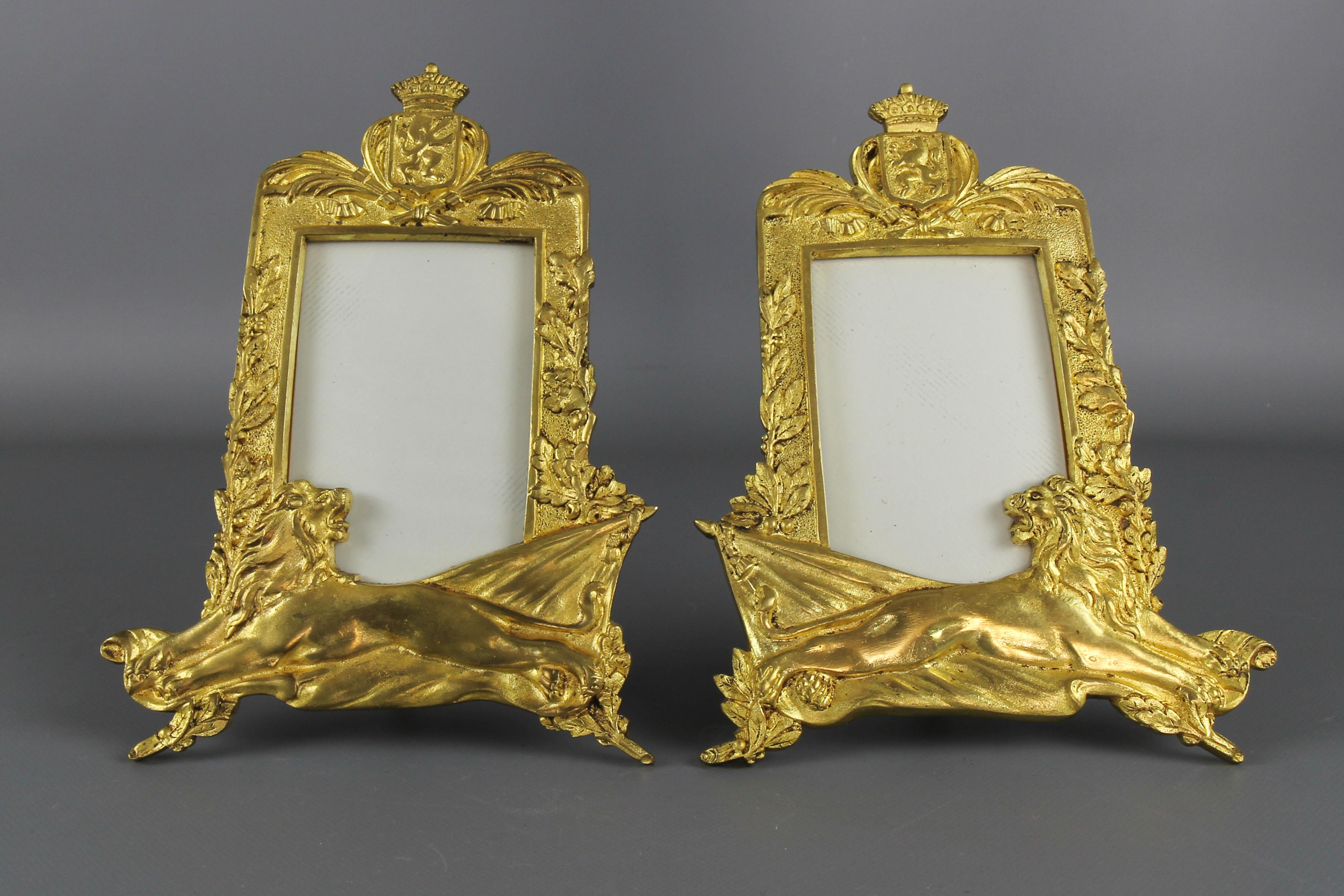 Pair of gilt bronze picture photo frames with lions and royal crowns, Belgium, circa the 1930s.
A magnificent pair of gilt bronze table photo or picture frames. These beautiful frames feature heraldic lions and a coat of arms of Belgium that bears
