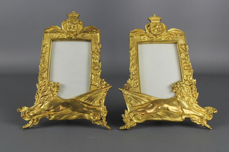 Pair of gilt bronze picture photo frames with lions and royal crowns, Belgium, circa the 1930s.
A magnificent pair of gilt bronze table photo or picture frames. These beautiful frames feature heraldic lions and a coat of arms of Belgium that bears