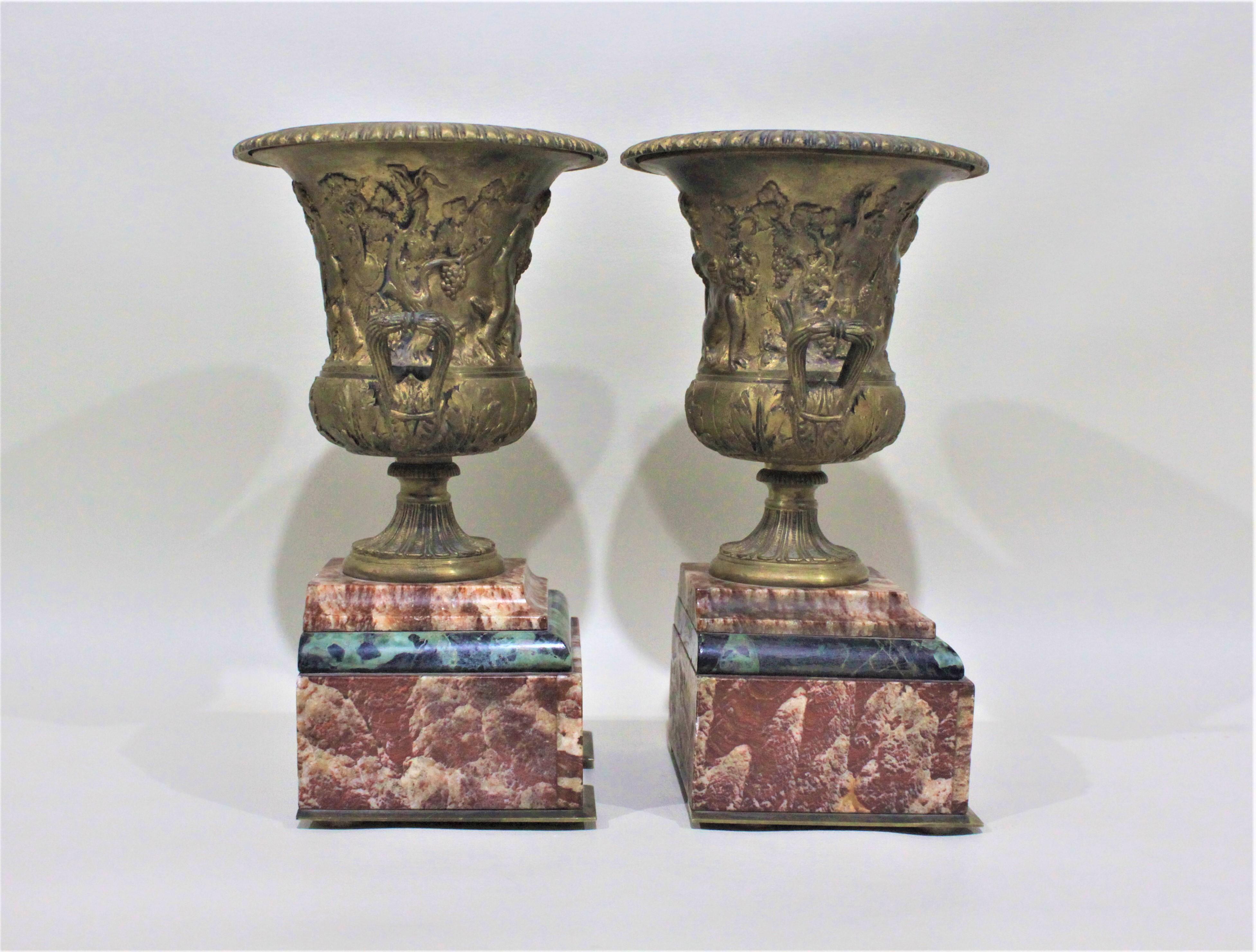 Neoclassical Revival Pair of Gilt Bronze and Polished Marble Garnitures or Urns For Sale