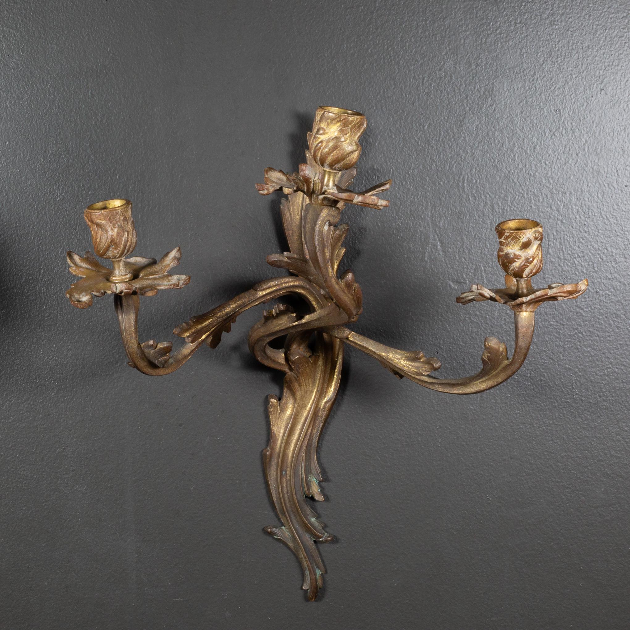 PAIR OF GILT-BRONZE SCONCES, LATE 19TH/EARLY 20TH CENTURY each sconce of scrolling foliate design with a pair of extended foliate arms.