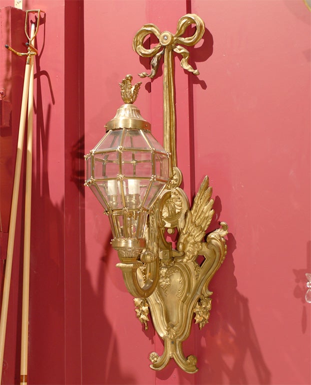 Very unusual pair of gilt bronze sconces with lanterns.