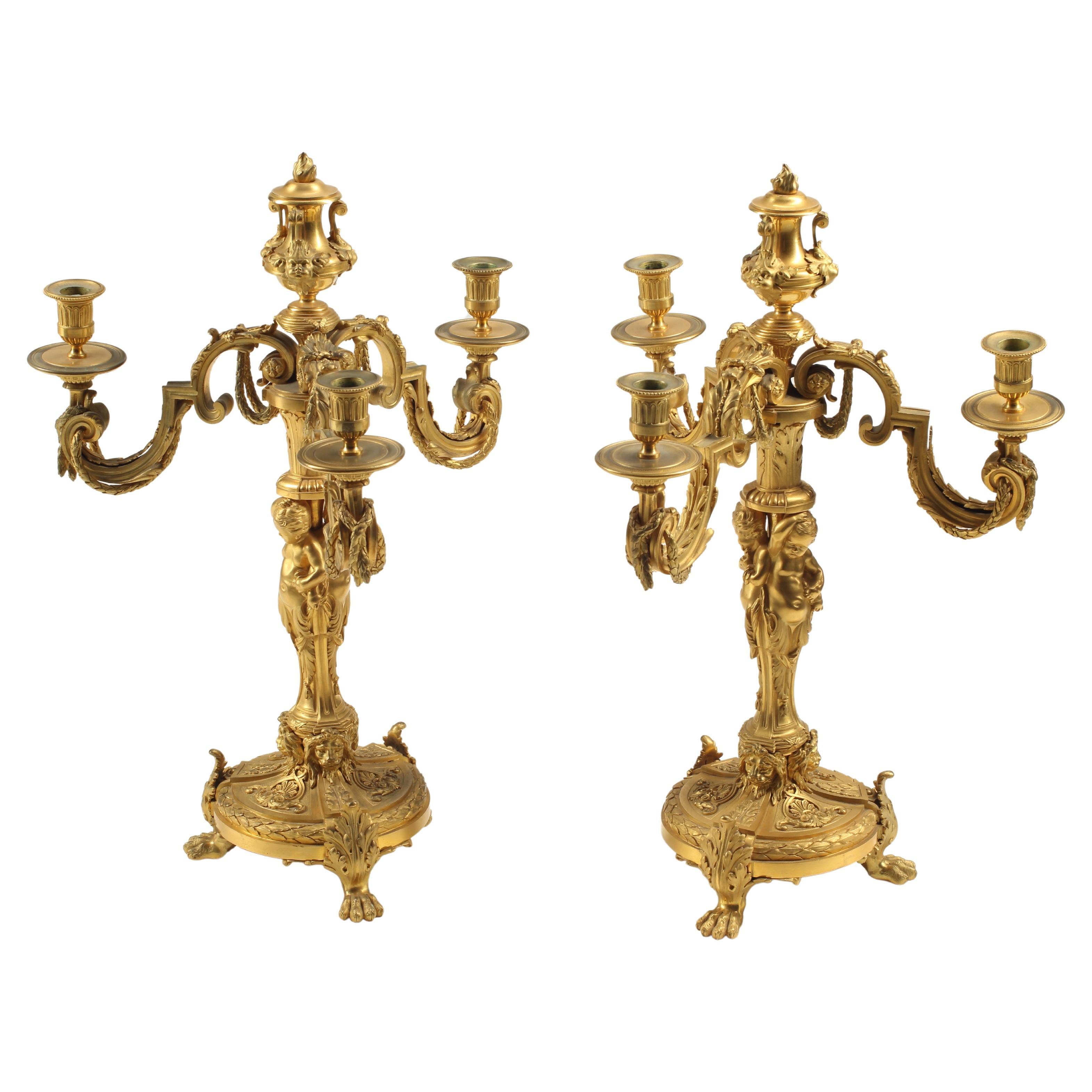 Coppia di candelabri a tre luci in bronzo dorato, XIX secolo, Francia
