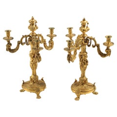 Coppia di candelabri a tre luci in bronzo dorato, XIX secolo, Francia