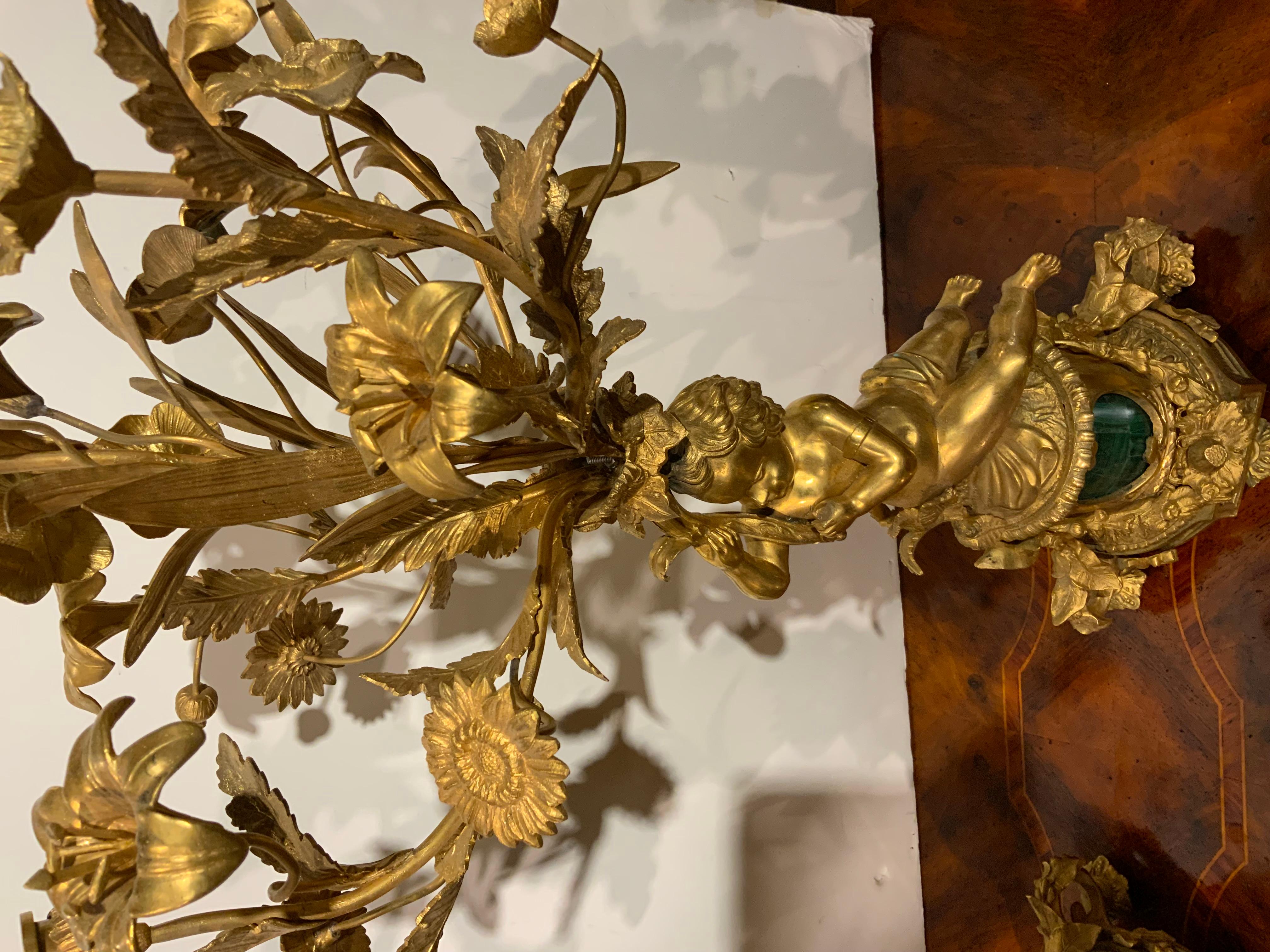 Pair of gilt bronze three lights each with putti, malachite centered at base In Good Condition For Sale In Houston, TX