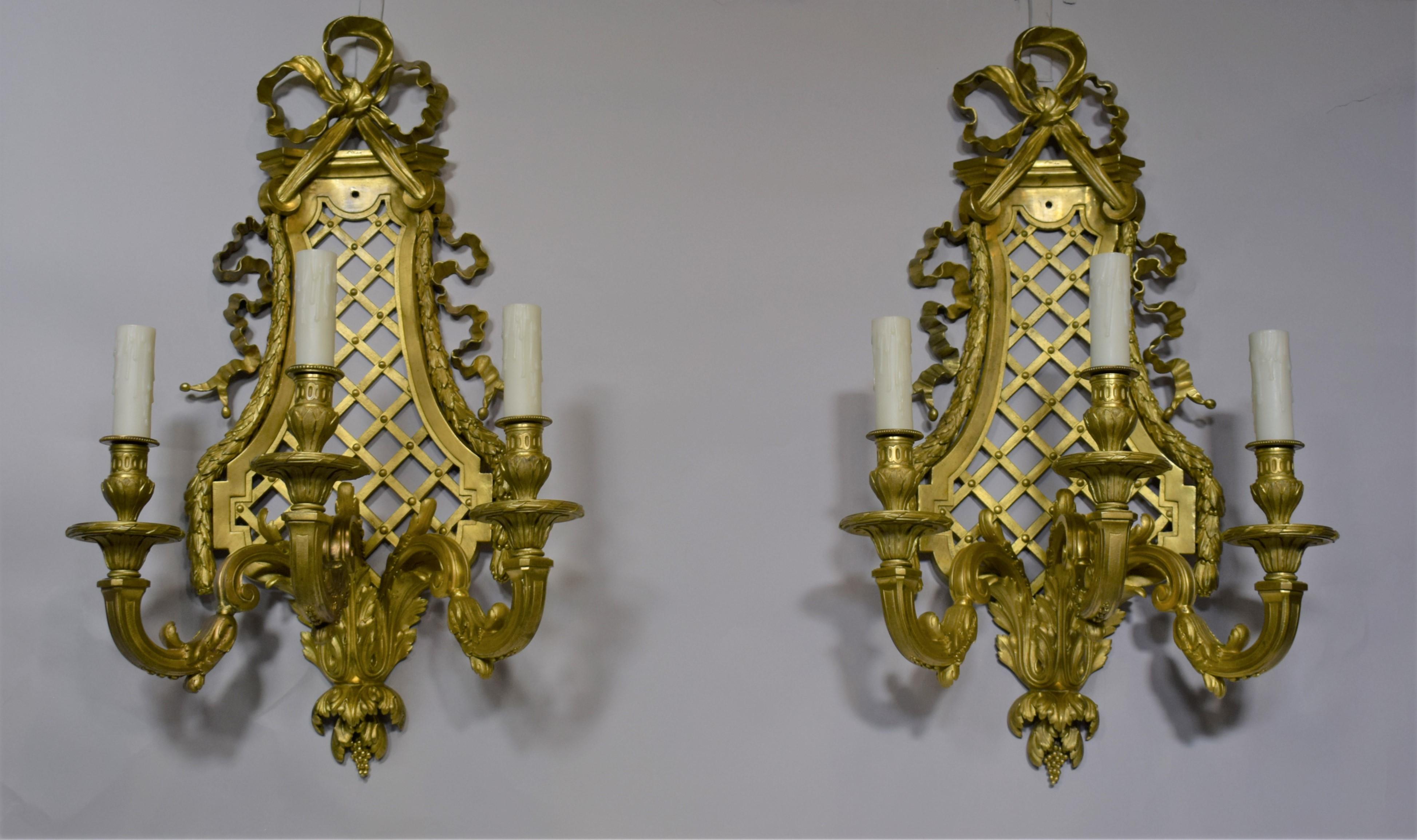 Pair of Louis XVI style gilt bronze wall sconces by Henri Vian. Exquisite Ribbon Detail and Trellis work. France, circa 1900.
Dimensions:
CW4947.
