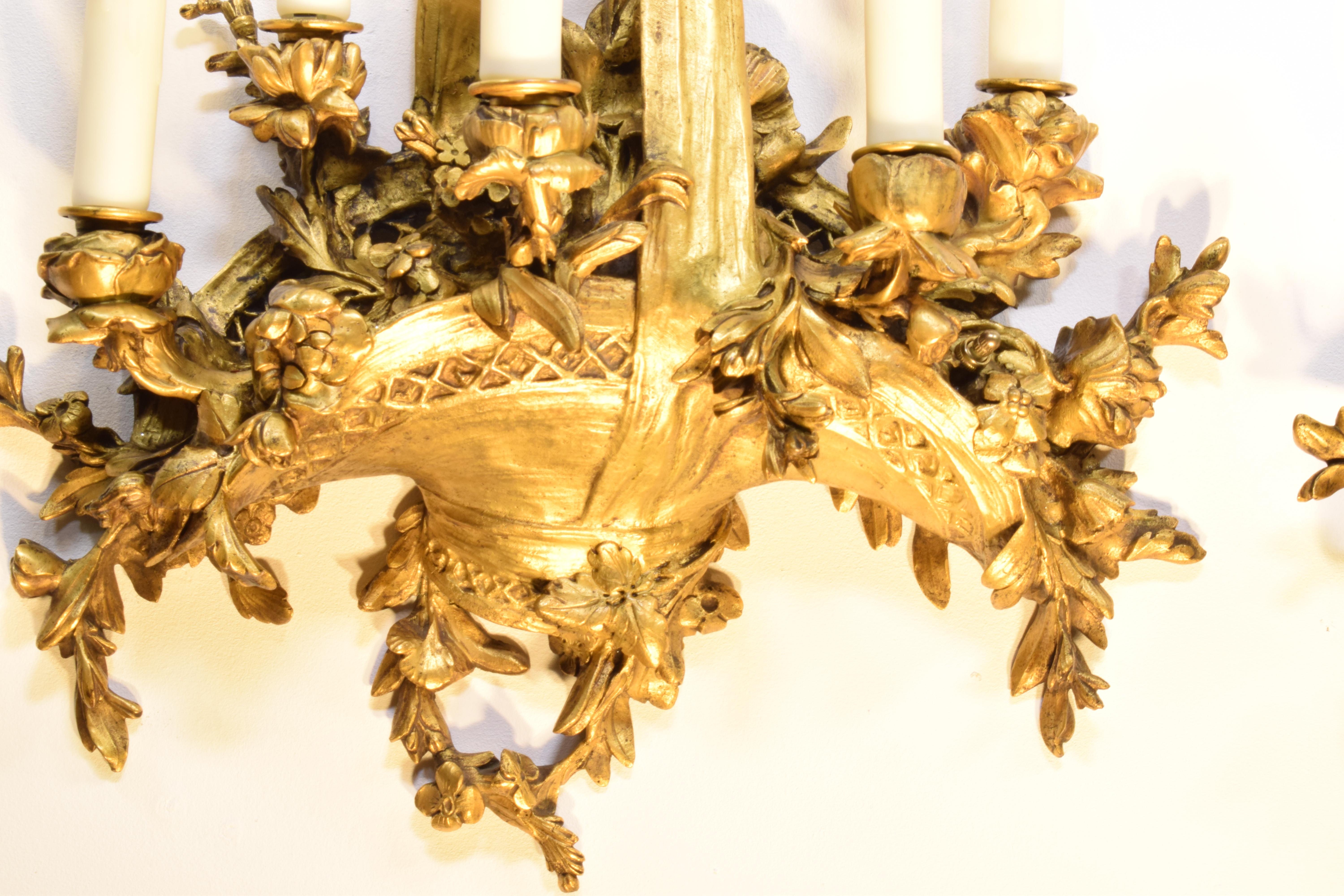An Extraordinary Pair of Gilt Bronze Wall Sconces. Great Quality. 
5 lights each. France, circa 1920. 
Dimensions: Height 38