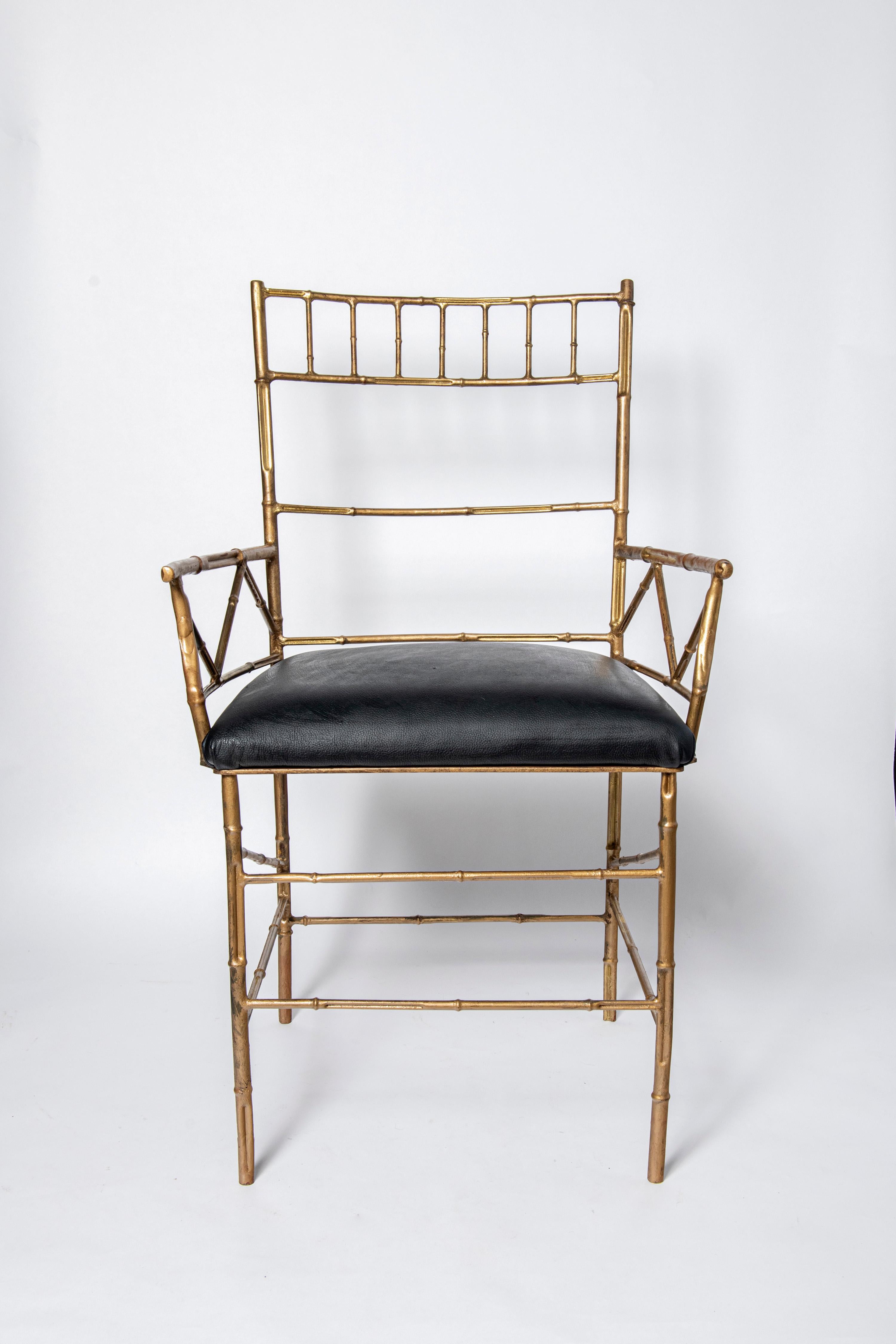 Mid-Century Modern Pair of gilt cast iron and leather armchairs. Italy, circa 1950. For Sale
