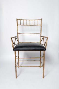 Pair of gilt cast iron and leather armchairs. Italy, circa 1950.