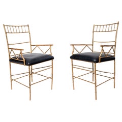 Retro Pair of gilt cast iron and leather armchairs. Italy, circa 1950.