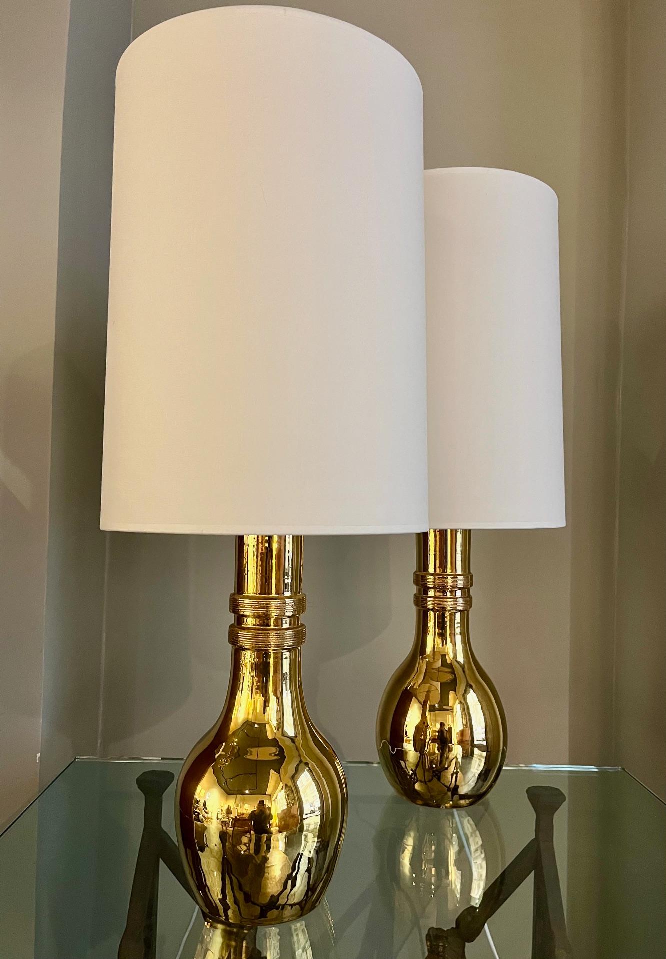 Pair of  ceramic lamps by Bitossi

Pair of gilt ceramic lamps.
By Bitossi (manufacturer) for Miranda ( Swedish retailer ) 
Italy, 1960

Dimensions :
Height ( total - with lampshade ) : 75 cm ( 29.5 inches )
Height ( ceramic) 36 cm ( 14.2 inches
