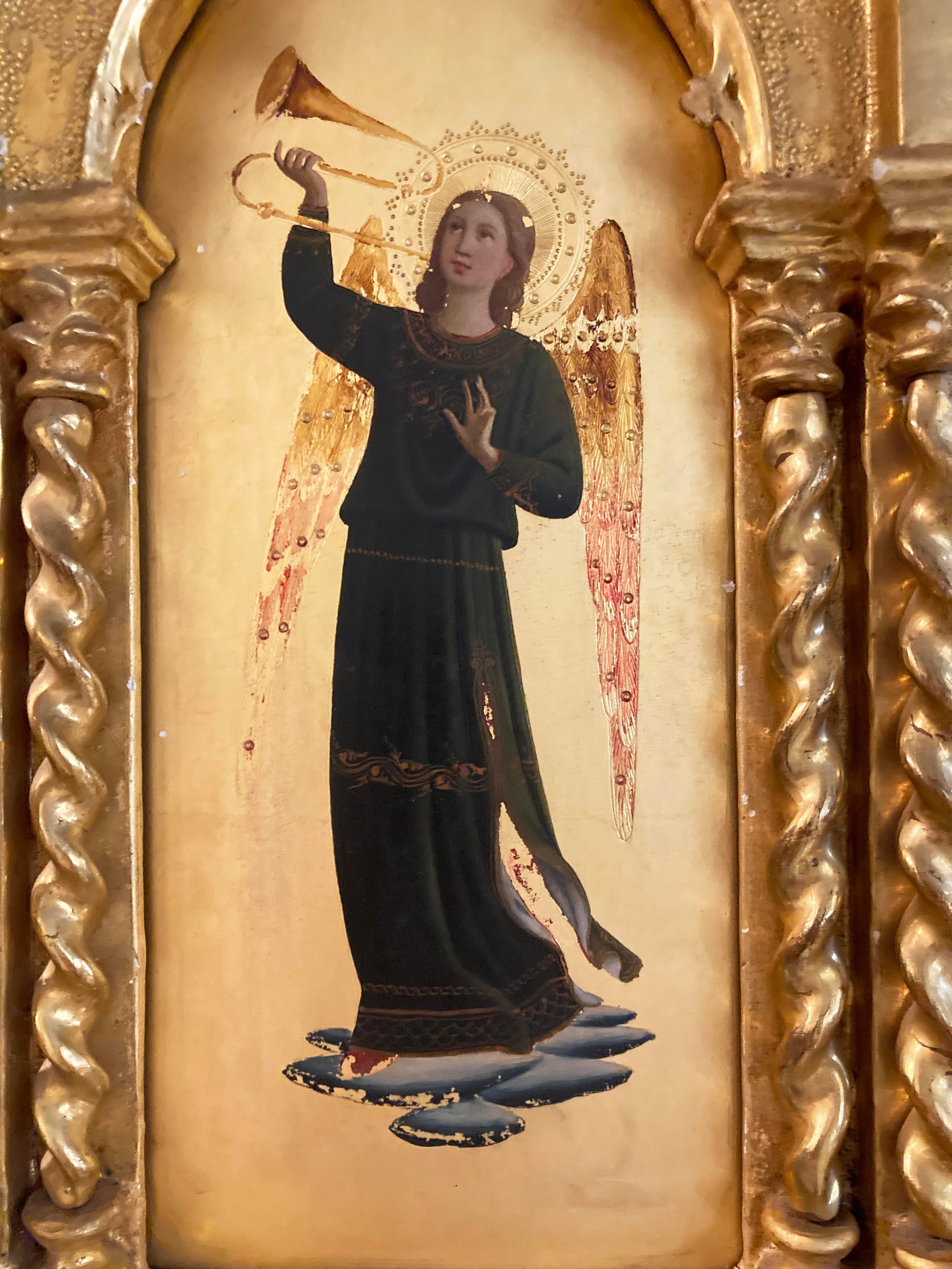 Two gilt framed Gothic Angels framed and painted in the style of Fra Angelico - hand-carved in Italy in 1890. These are in excellent condition with little to no paint chipping and wonderful colorfastness. The spiral spindles should be handled with