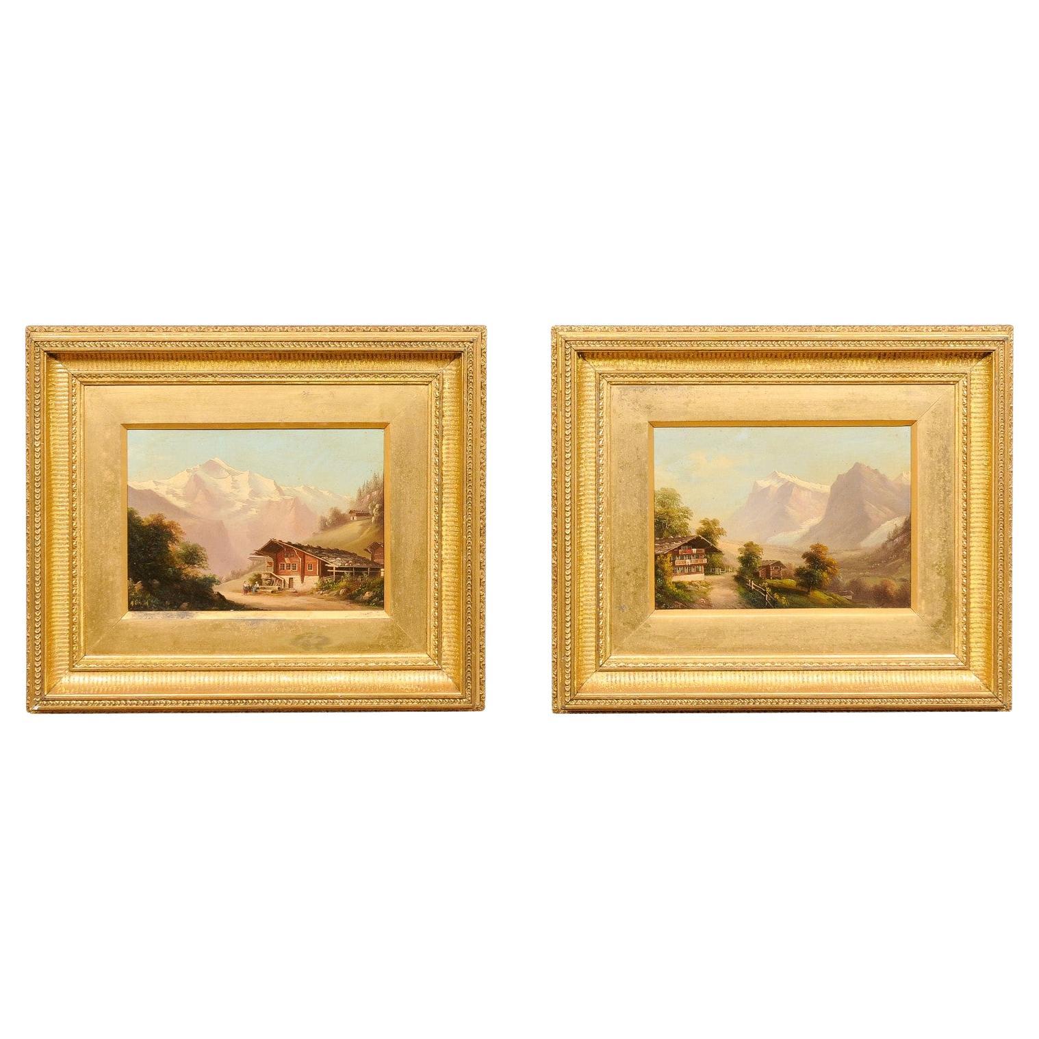 Paire de peintures à l'huile sur panneau encadrées et dorées représentant des scènes de montagne, 19e siècle