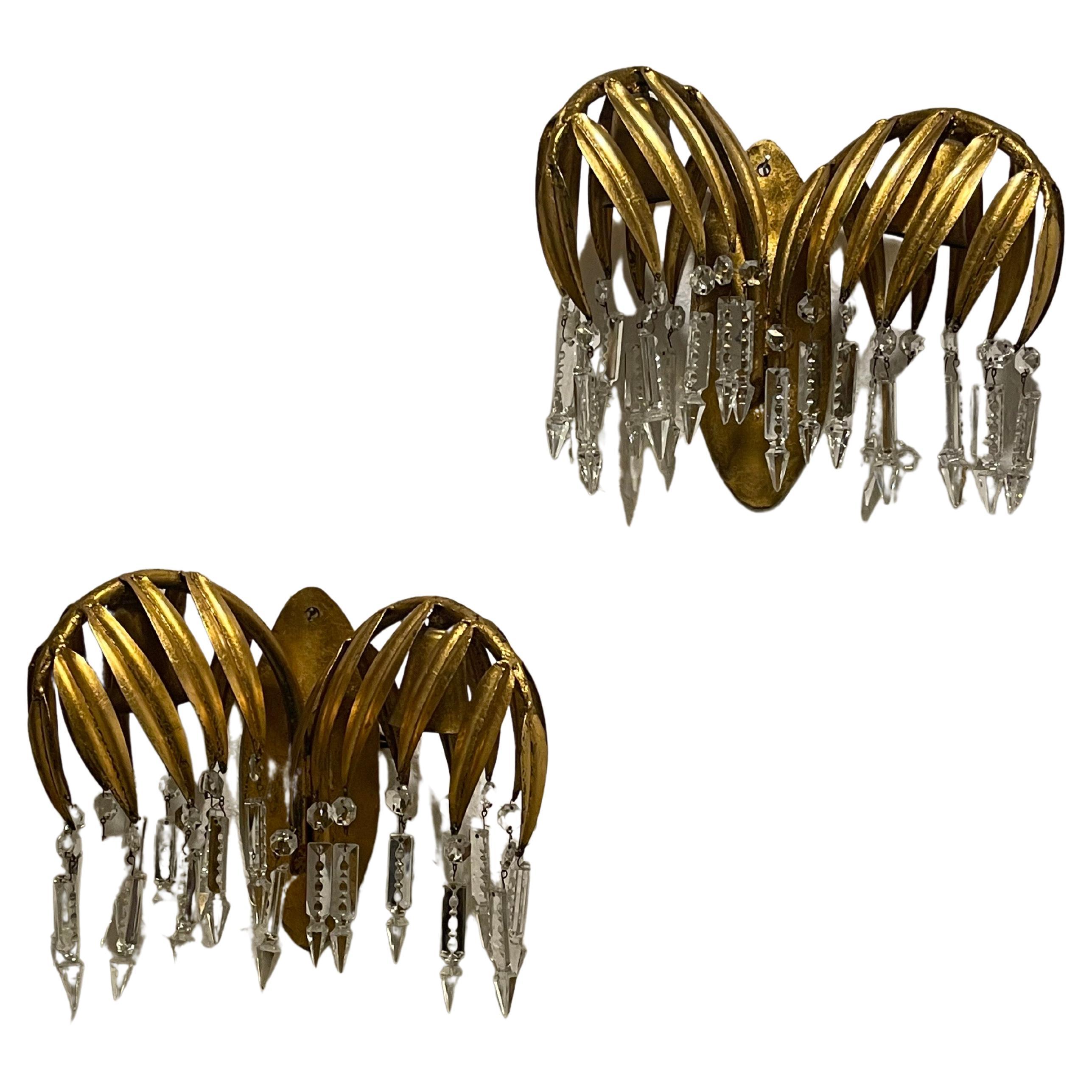 A pair of gilt iron and cut-crystal palm tree wall sconces attr. to Hans Kögl, Germany, circa 1960s.
Socket: Each 2 x E14 ( for standard screw bulbs).
This rare wall sconces are in an excellent vintage condition.

New wiring for US standards on