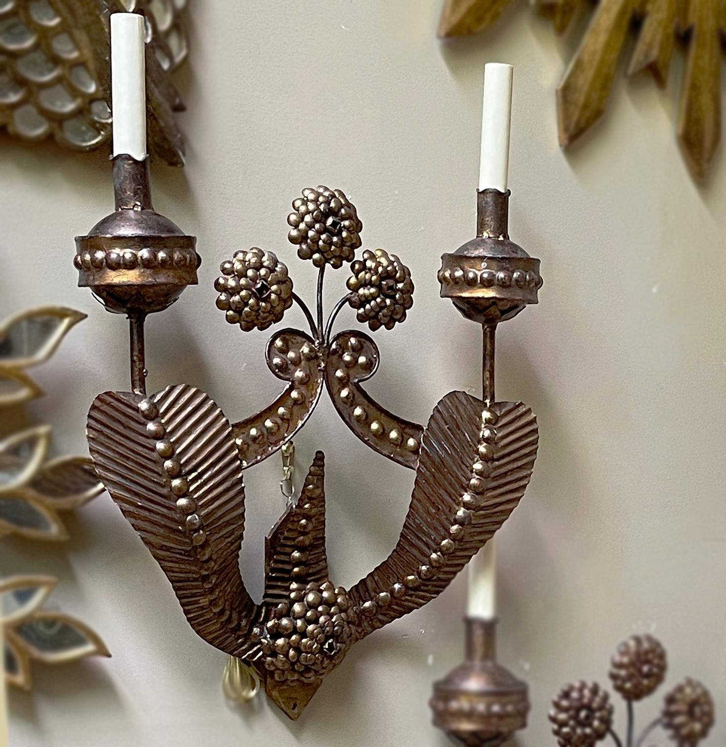 A pair of circa 1940's Italian gilt iron double light sconces with flower detail.

Measurements:
Height: 21