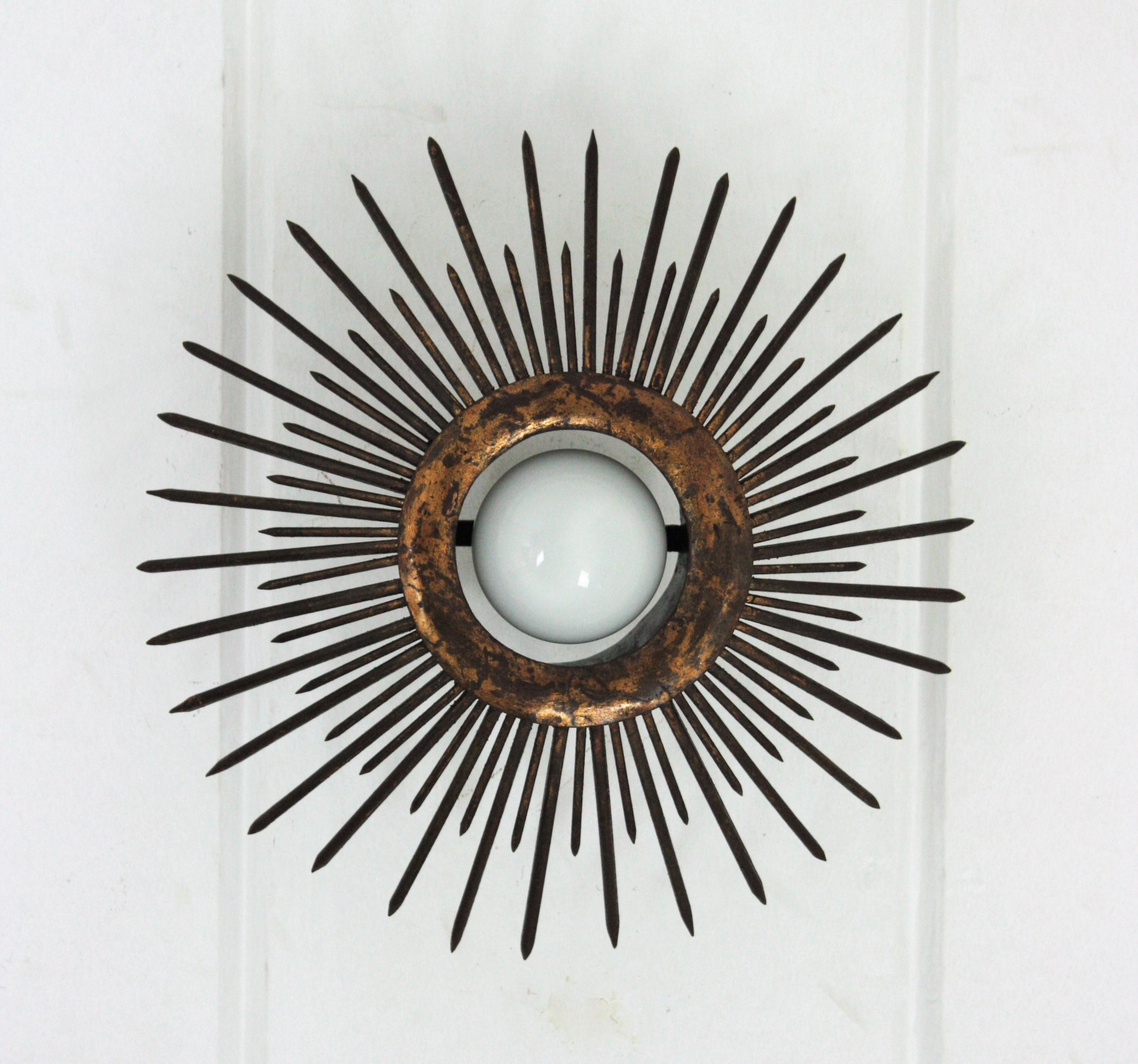 French Pair of Gilt Iron Sunburst Brutalist Light Fixtures with Design of Nails For Sale