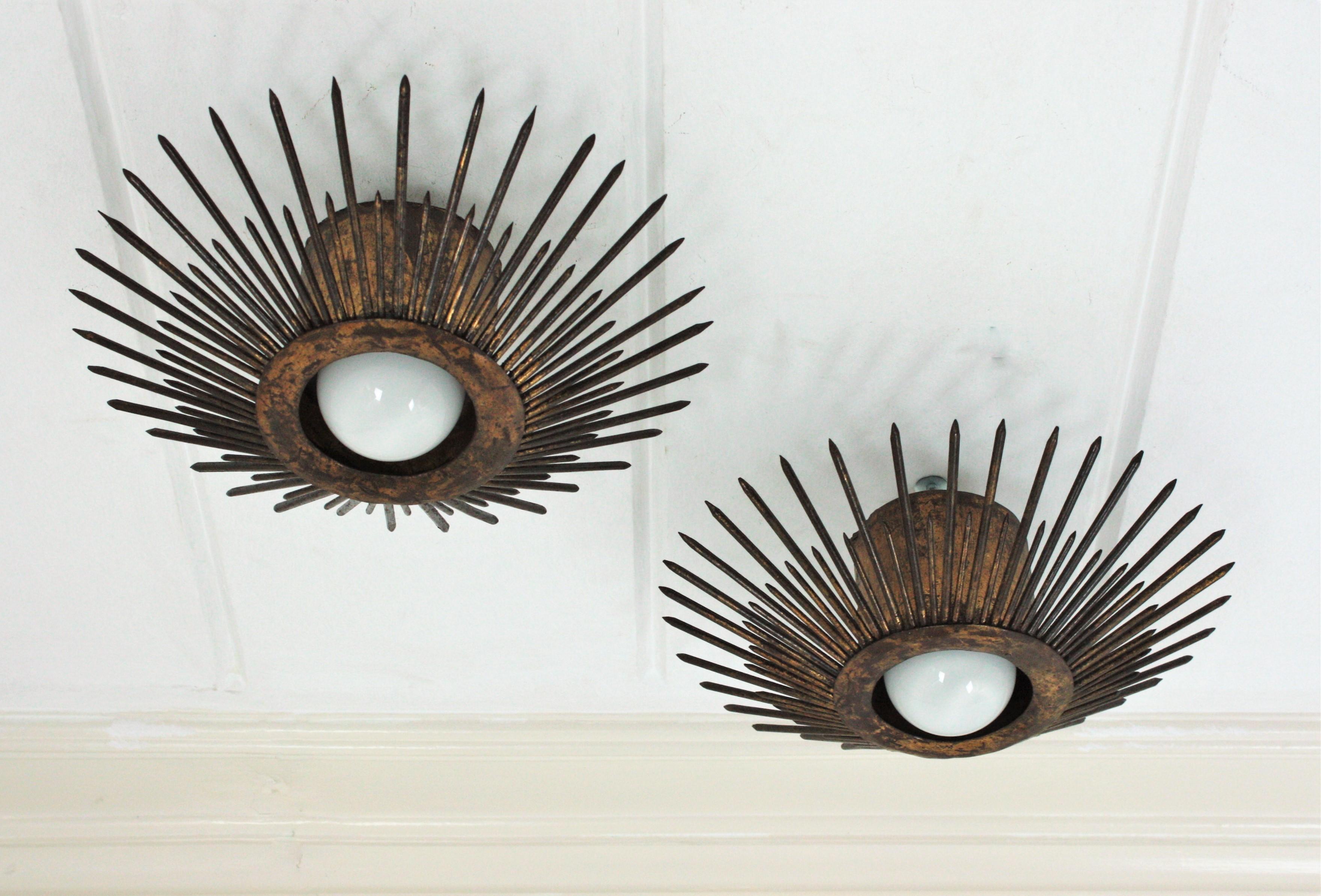 Hammered Pair of Gilt Iron Sunburst Brutalist Light Fixtures with Design of Nails For Sale