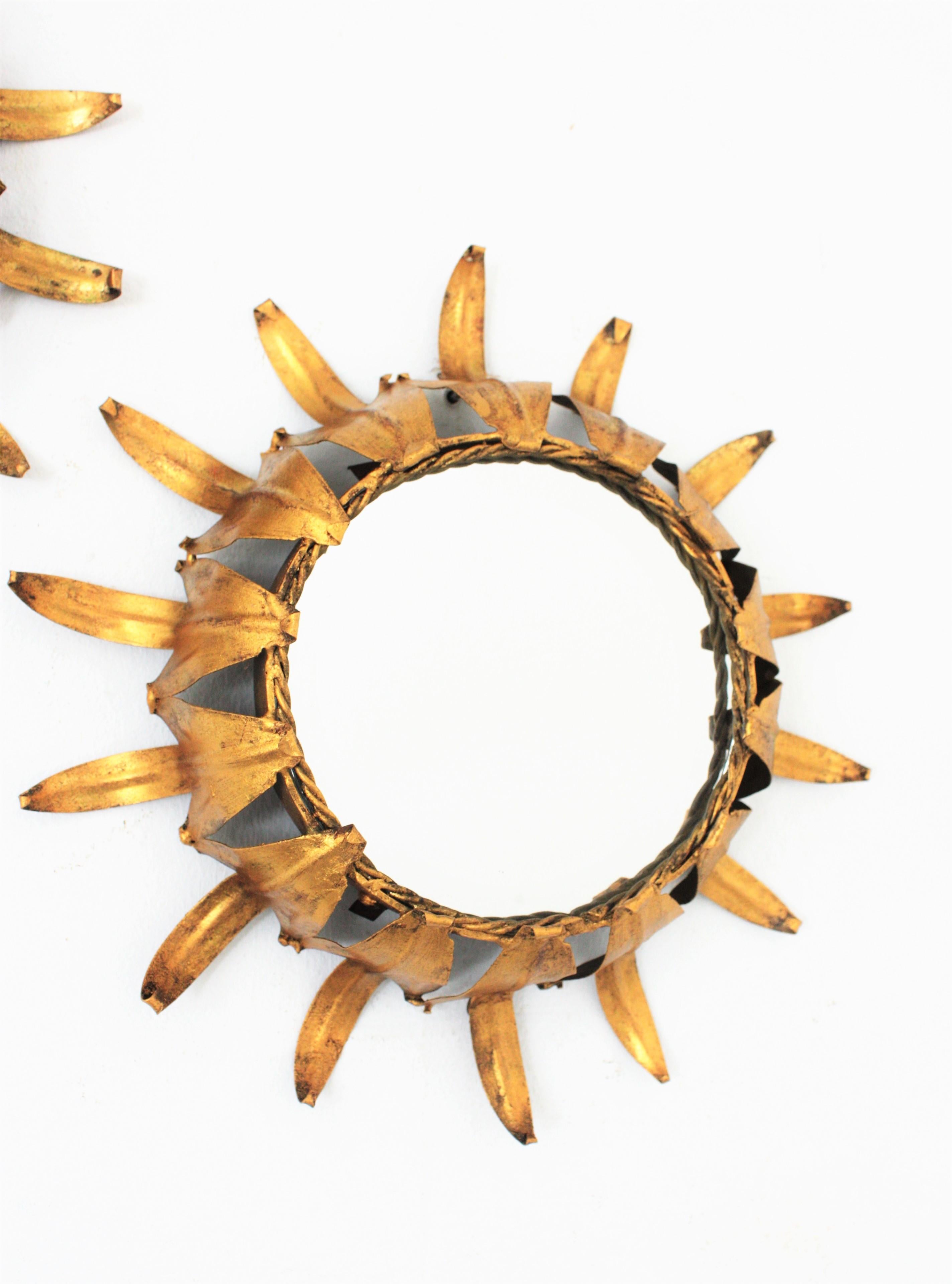 20th Century Pair of Sunburst Wall Mirrors in Gilt Iron in the Style of Hollywood Regency