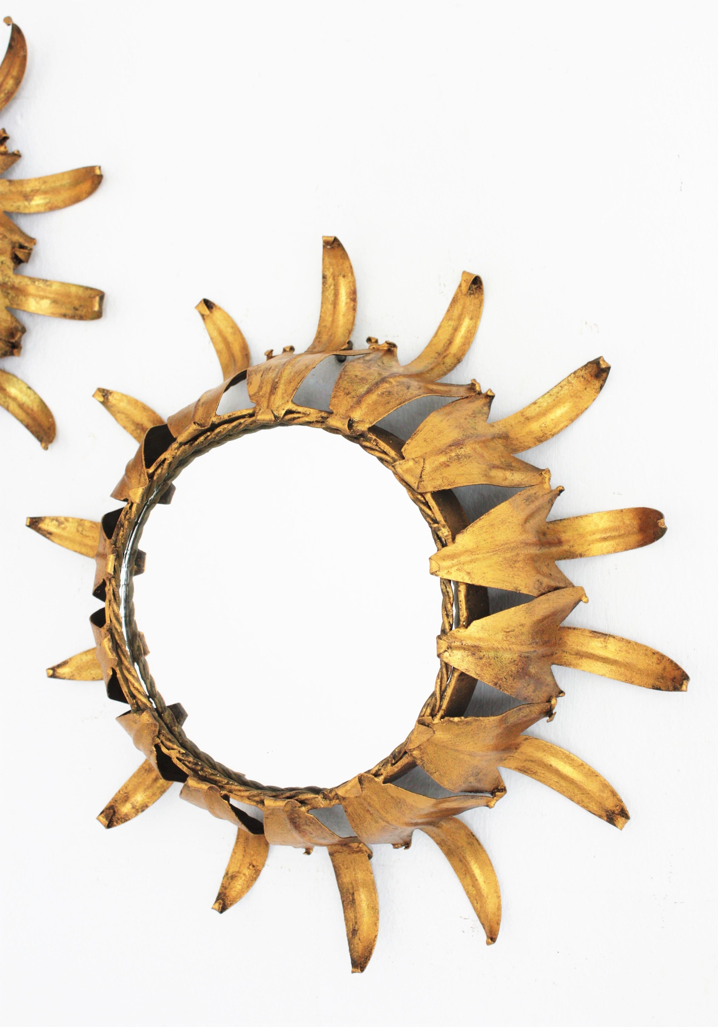 Metal Pair of Sunburst Wall Mirrors in Gilt Iron in the Style of Hollywood Regency