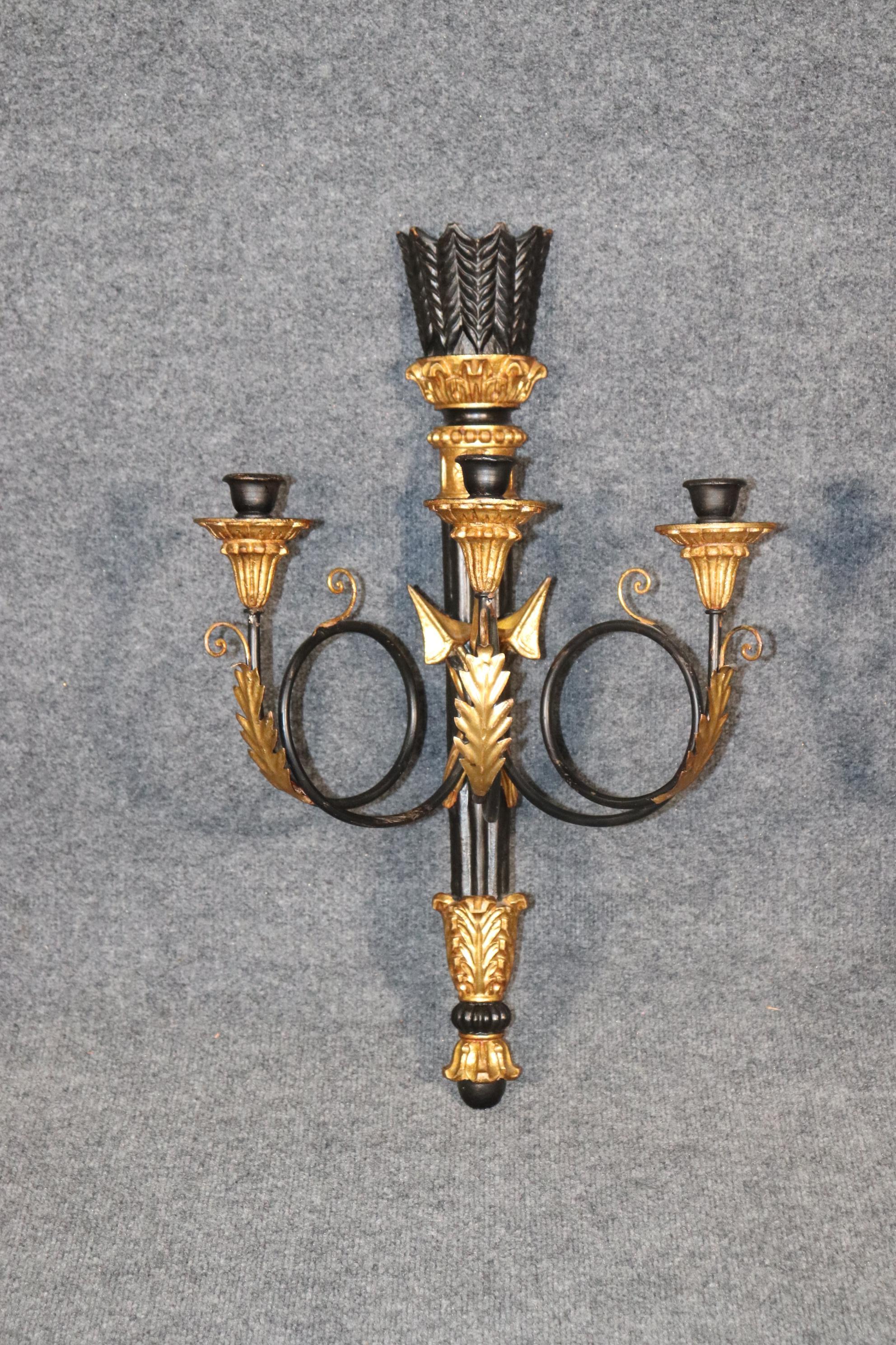 Dimensions: H: 25in W: 15.5in D: 10in
This pair of gilt Louis XVI Directoire style ebonized wall sconces are done beautifully and made of the finest quality. This Pair of sconces will add a touch of Sophistication and subtleness into every into