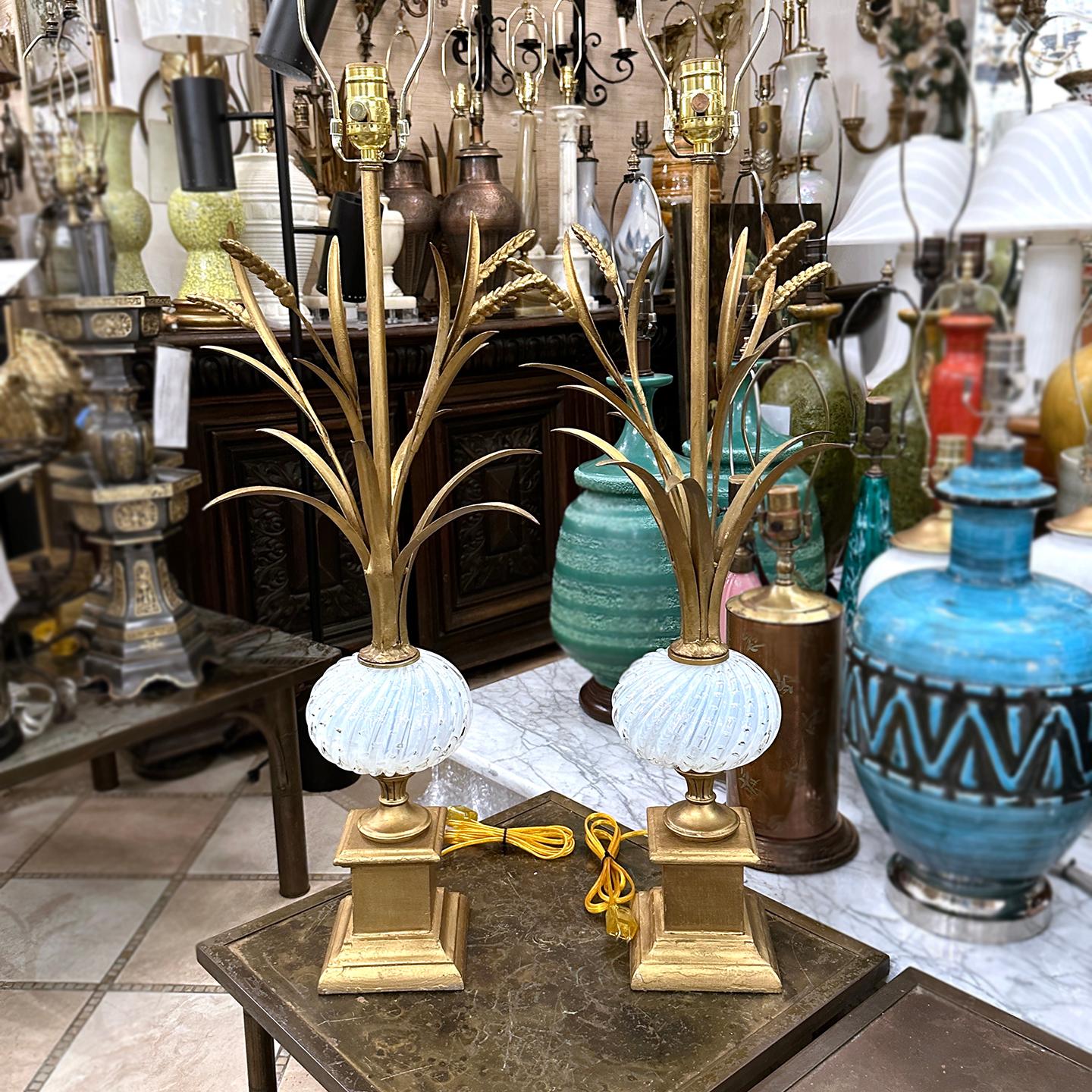 Pair of circa 1950’s Italian gilt metal lamps with Murano glass body.

Measurements:
Height of body: 28″
Height to shade rest: 38″
Width: 11″
Depth: 11″