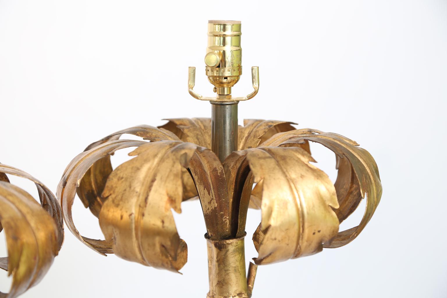 Pair of lamps, of gilded iron, shaped as stylized palm trees, set upon round bases of Lucite.

Stock ID: D2524.