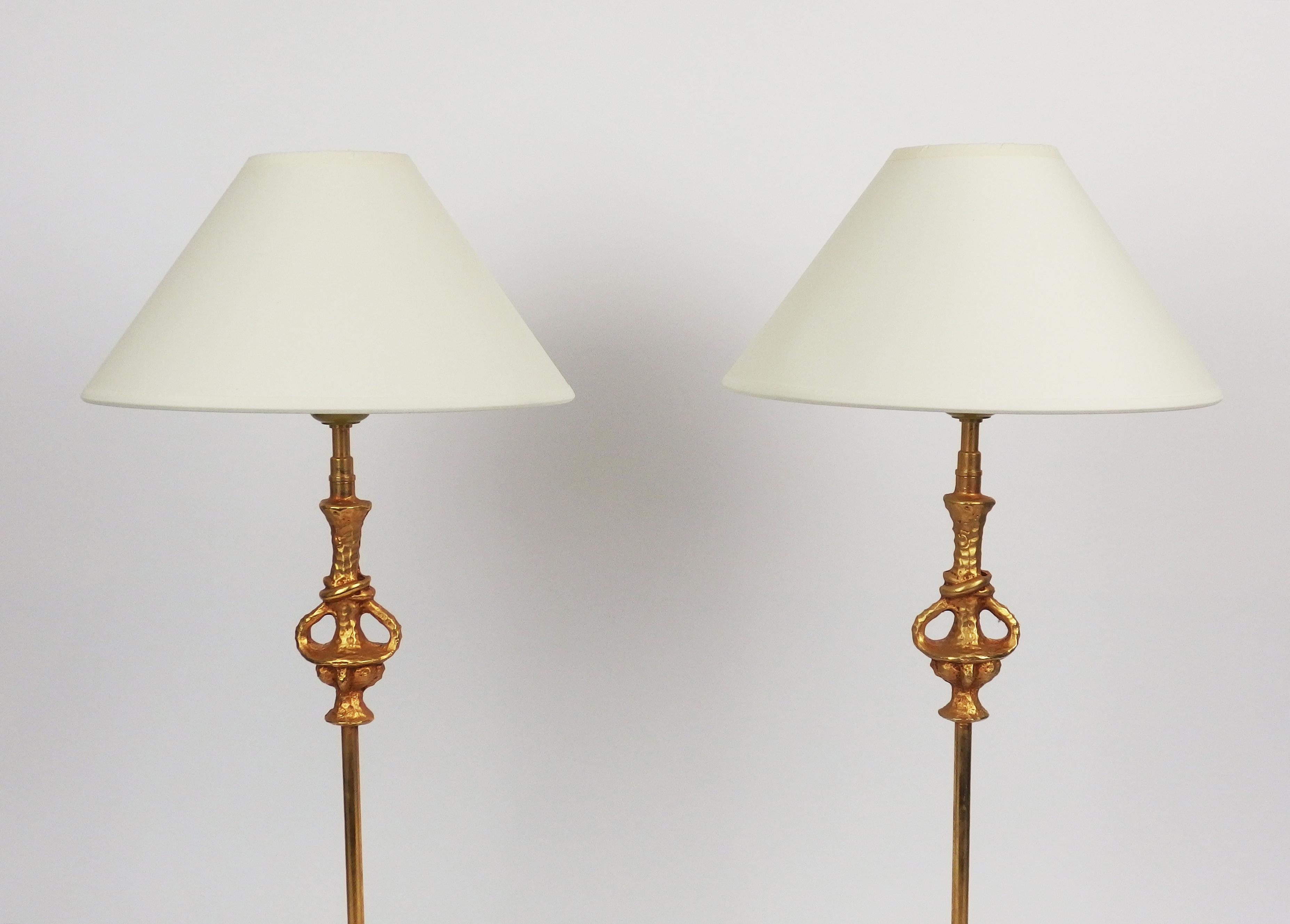 Two elegant gilt metal table lamps designed by Nicolas de Wael and edited by Fondica. Signed.
Dimensions without the shades:
Base:4.13inX4.13in
Height:20.66in
Nicolasde Wael designs lamps & table ware for several manufactures (among them: