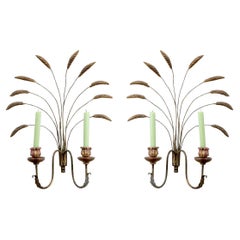 Coppia di candelabri in metallo dorato e Wood