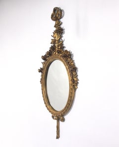 Pair of Gilt Oval Mirrors