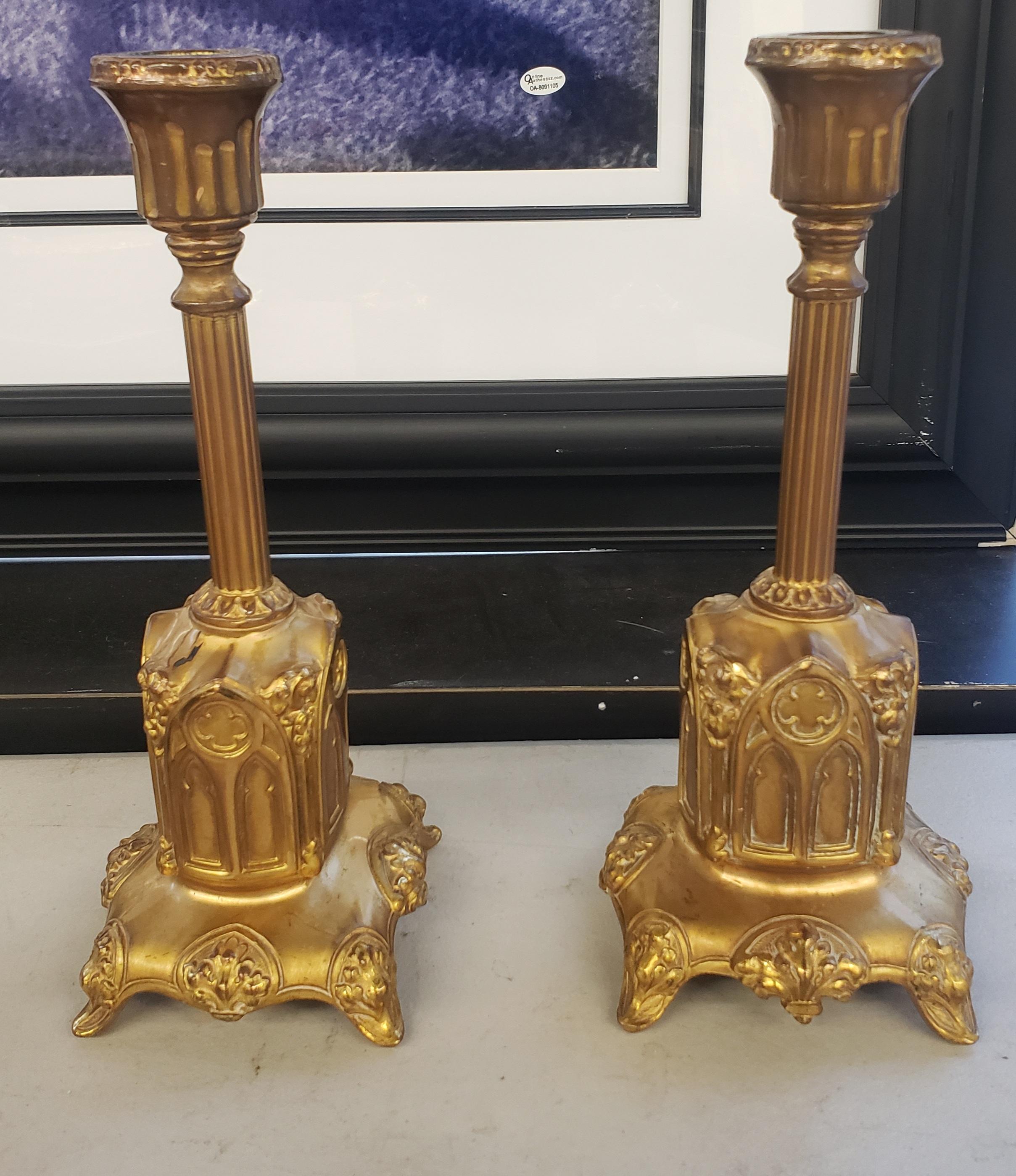 A unique pair of gilt ormolu patinated metal candleholders in the ecclesiastical style.
Good antique condition.