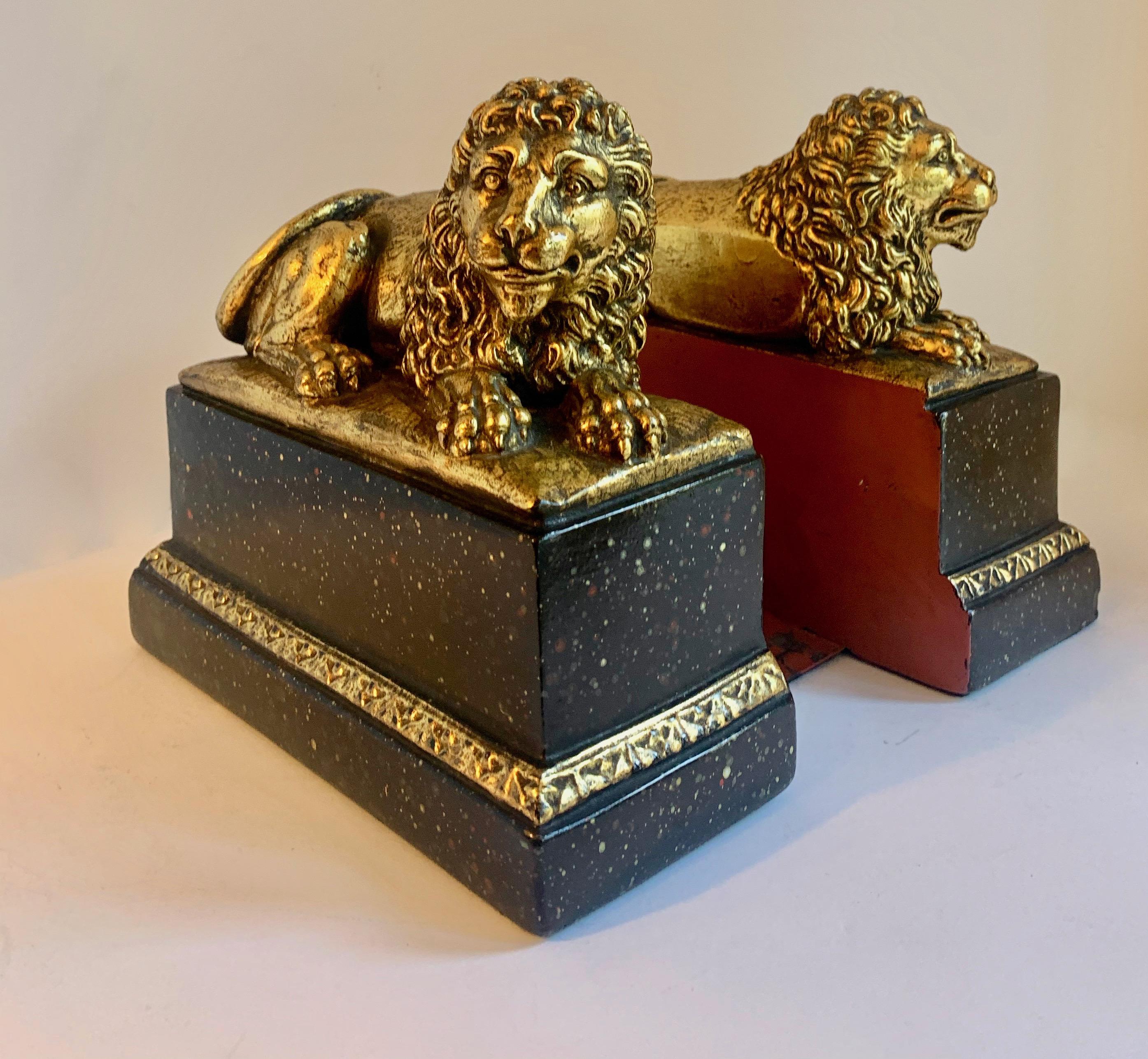 Mid-Century Modern Pair of Gilt Reclining Lions on Black Stands