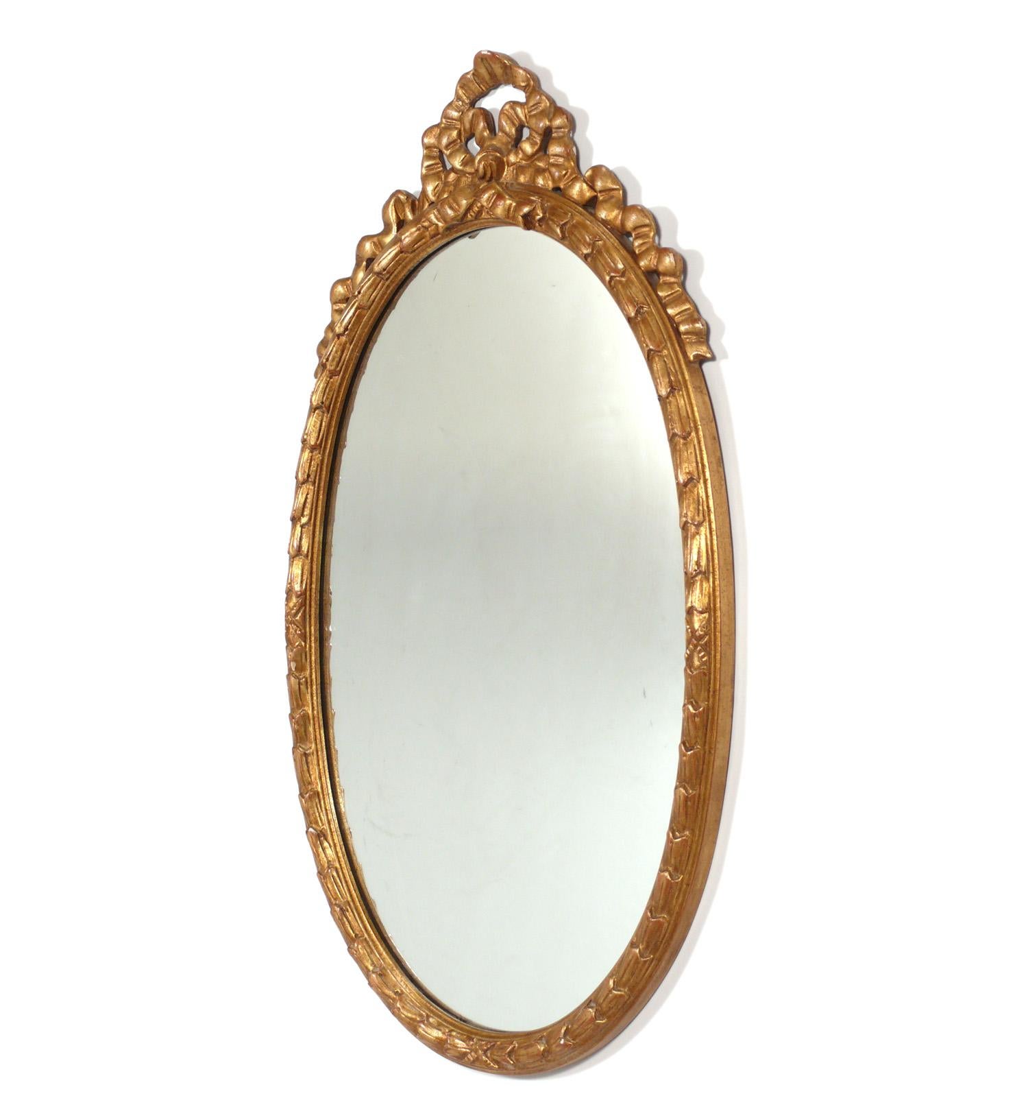 Pair of Gilt Rococo Style Oval Italian Mirrors, Italian, circa 1940s. They have been recently removed from The Carlyle Hotel in NYC. They are priced at $1800 each or $3300 for the pair. They measure 38.5